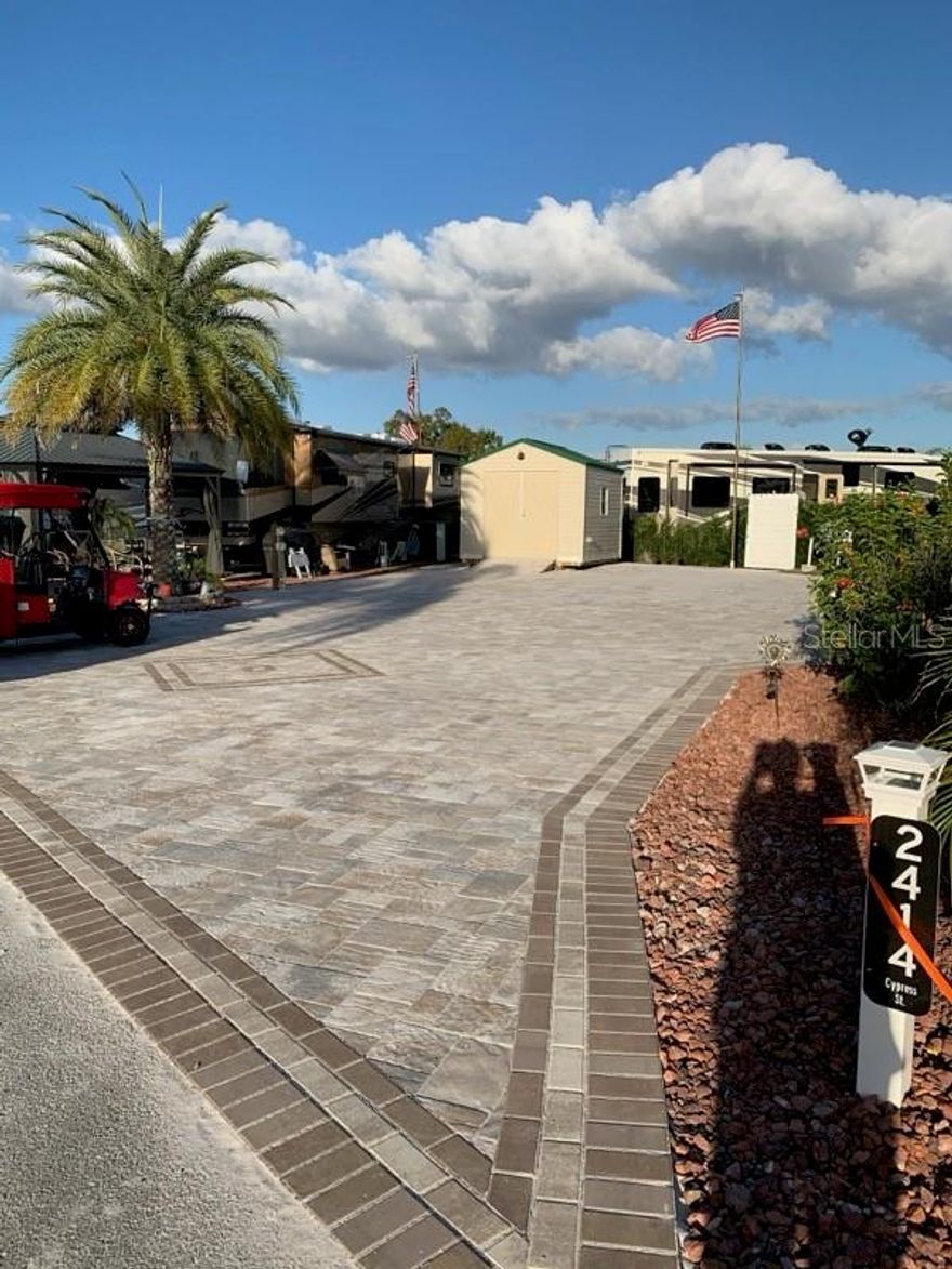 Experience the ultimate outdoor lifestyle just 25 minutes from the magic of Disney World! This spacious RV lot, located within the premier Citrus Valley RV Park, is perfectly designed for your adventures. Featuring a beautifully crafted paver driveway and lush landscaping, this lot creates an inviting atmosphere for relaxation and fun. Included is a large 12X16' metal patio cover and a large 10x12' shed, with plenty of parking.
Enjoy outdoor gatherings or peaceful evenings sitting on your patio. With the clubhouse and swimming pool nearby.  A public bathhouse is just steps away for the convenience of your guests if they so wish!  
Don’t miss this exceptional opportunity to own a piece of paradise near Disney! Whether you're looking for a weekend getaway or a permanent retreat, this RV lot is the perfect choice for outdoor enthusiasts.