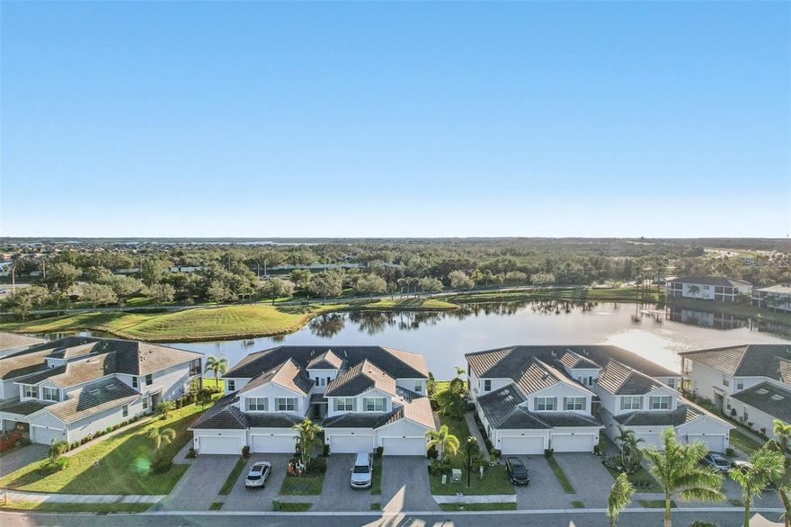 Boat slip and electronic lift available for rent with purchase of condo. Welcome to Tidewater Preserve, a premier boating community for a Waterfront Lifestyle. Attention, this 1st floor Coach home was BUILT in 2019 and is located in the New Shores part of Tidewater. This particular home looks like a model, and it has been lovingly maintained. Looks brand new! Live life in this wonderful 3-bedroom, 2-bathroom home which has lovely long water views! This home has hurricane rated windows and sliders. The new owners will enjoy the lanai screened door for convenience and also the fact that this is a pet friendly community that has its own dog park. Tidewater Preserve is a lifestyle! The unit itself has crown molding, tile on the diagonal with tile in the bedrooms, no carpet, Ring security doorbell system, cameras, flood lights, coded entry, Honeywell smart thermostat connected to Alexa. The kitchen has Quartz counter tops along with a large island also made of quartz, and newer stainless-steel appliances, walk in pantry, great breakfast bar area for additional seating, modern pendant lights, stylish backsplash, and a separate laundry room. The dining room has a lovely chandelier perfect for entertaining. Your clients will love the Open floor plan. The primary bedrooms have walk-in closets, and the ensuite has a wonderful shower, soaking tub, and dual sinks with quartz countertops. The attached 2 car garage has added storage racks added for additional space. Tidewater Preserve is conveniently located near I75, its main pool rivals top resorts with River views and an outdoor grill. The Clubhouse has a nice community kitchen, pool table, fireplace, library and hosts many events. They have 2 fitness centers, 2 satellite pools, a Marina with a 2nd Clubhouse, tennis courts, kayak and canoe launch, walking trail for scenic walks overlooking the Manatee River. Come see what all the fuss is about and leave the concrete jungles up North! Boat slips are available.