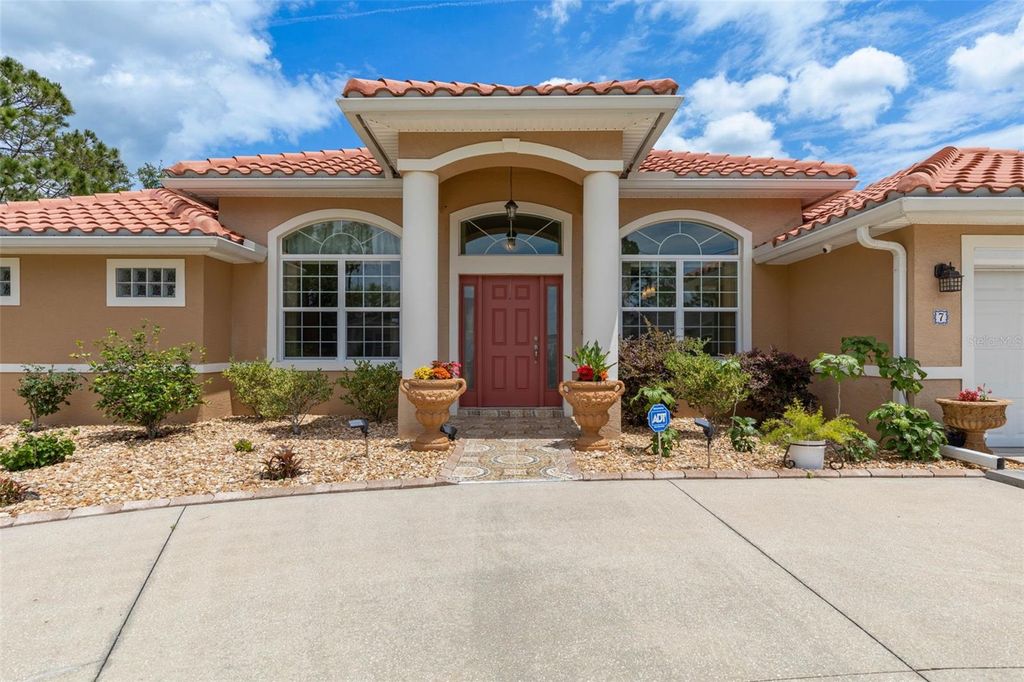 Photo of 7 Flint Hill Lane, Palm Coast, FL 32137 (MLS # FC318282)