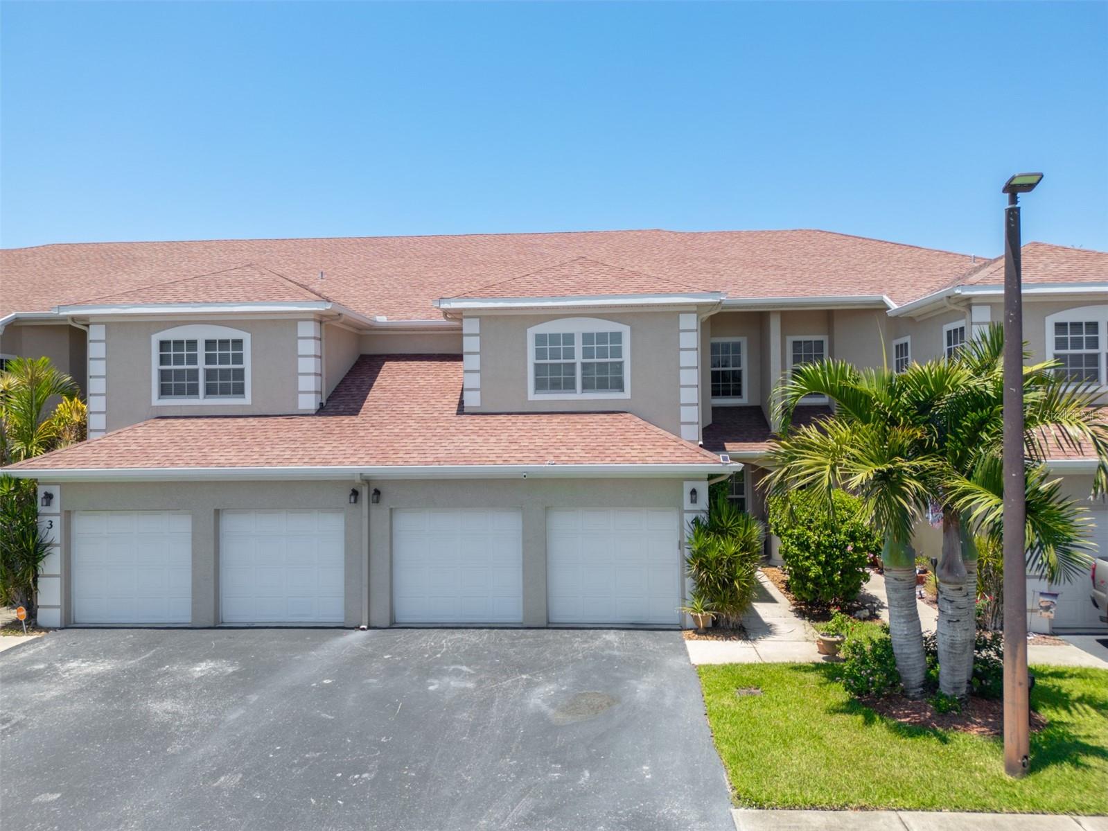 Just steps from Cocoa Beach and the iconic Pier, this spacious 3 Bed/2.5 Bath condo blends comfort, style, and coastal convenience. The open living area features vaulted ceilings and large windows for abundant natural light. The kitchen includes modern appliances, granite countertops, and ample cabinet space. The primary suite offers laminated wood flooring, a walk-in closet, and a tiled en suite with granite vanity, jetted soaking tub, and walk-in shower. Two additional bedrooms provide space for guests or a home office. Updated fixtures in all bathrooms add a polished touch. The laundry room features granite counters, a large utility sink, and generous storage. Additional highlights include a newer Trane HVAC with service warranty, whole-house water filtration, and impact windows and doors. Enjoy the covered patio with a custom pergola overlooking a landscaped backyard and pollinator garden. Pet-friendly with low HOA. Minutes to shopping, dining, Port Canaveral, and the beach!
