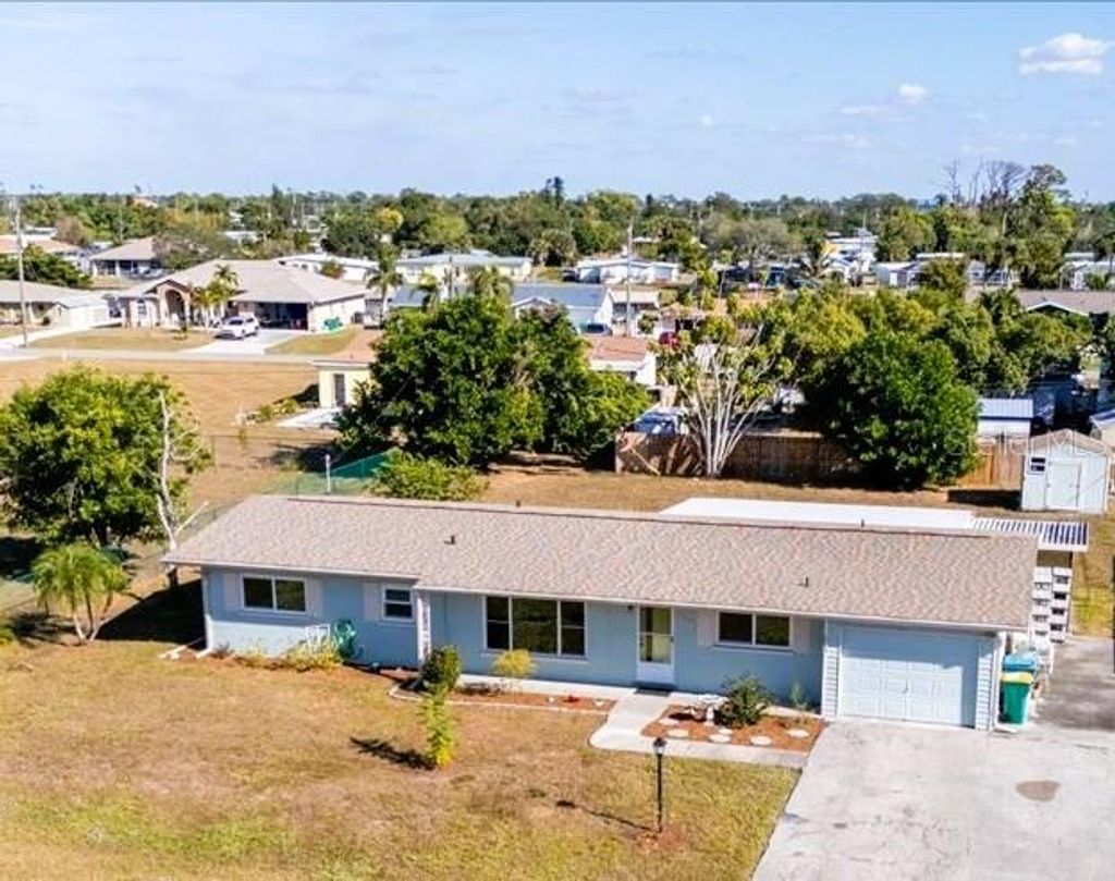 Photo of 151 Emmett Avenue NE, Port Charlotte, FL 33952 (MLS # C7517790)