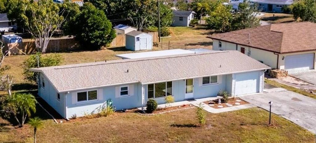 Photo of 151 Emmett Avenue NE, Port Charlotte, FL 33952 (MLS # C7517790)