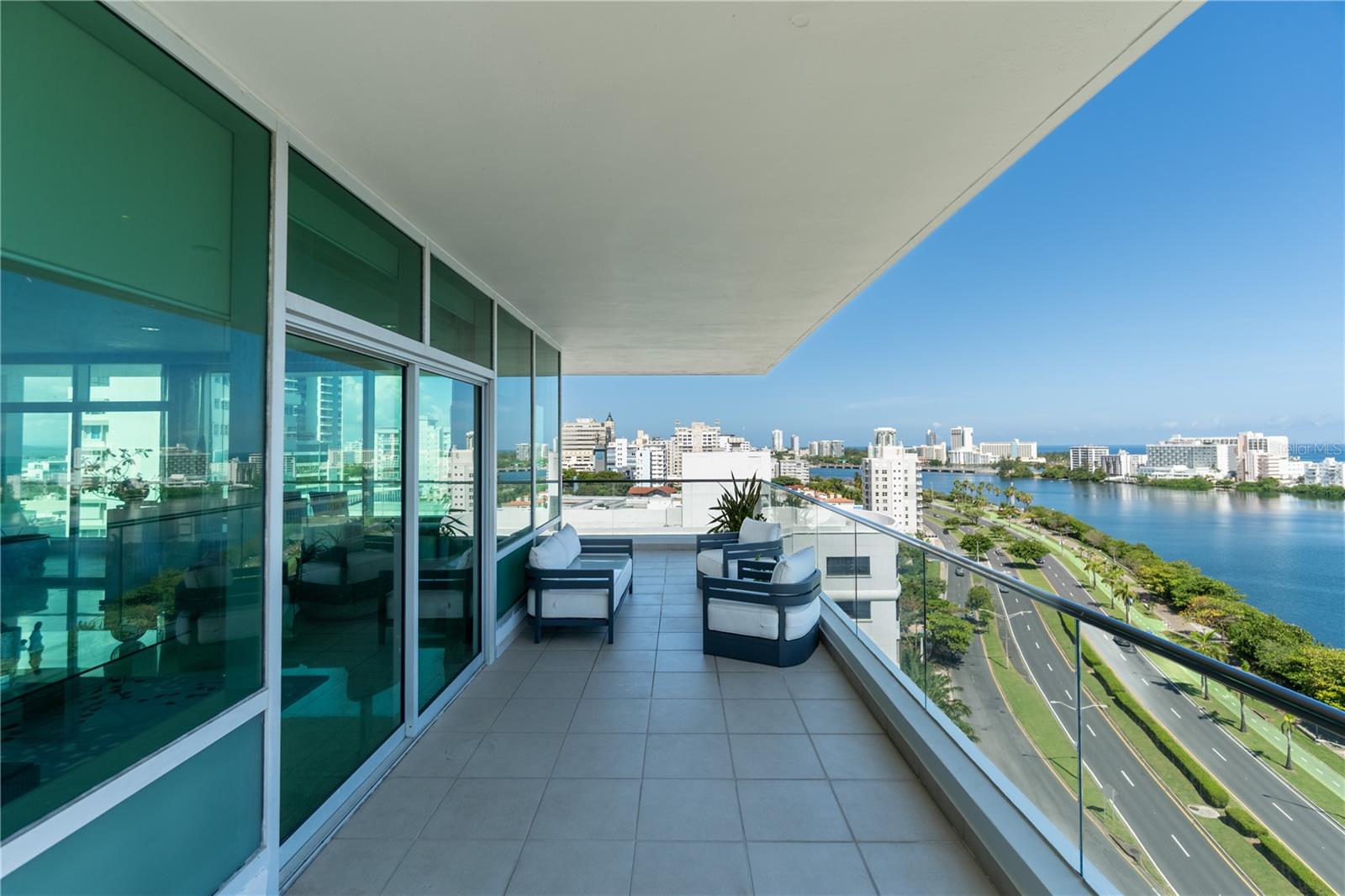 Elegant 11th-floor residence with 3 bedrooms, 3.5 baths, and approximately 3,005 sq. ft. of total construction. The layout features an open living and dining area with abundant natural light, private balcony with city and water views, and a well-defined bedroom wing.
The primary suite offers a spa-inspired bath and private balcony, complemented by two additional bedrooms with ensuite baths. A laundry room and three covered parking spaces add comfort and convenience.
The Cosmopolitan provides full amenities including concierge service, 24-hour security, infinity pool, landscaped outdoor spaces, executive conference room, lounge and bar, billiard room, play area, and fitness center.
Located in Miramar’s Arts District, the building is steps from the Condado Lagoon, beaches, fine dining, shopping, and cultural venues.