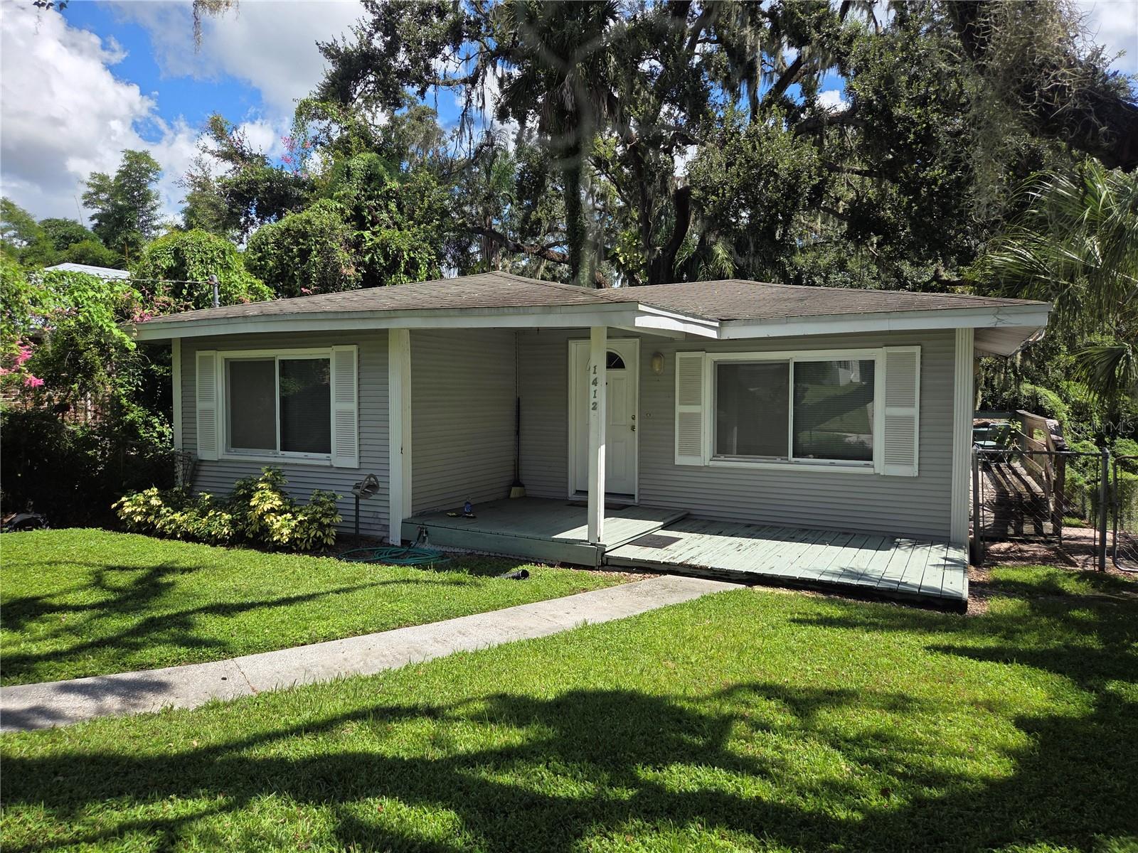 FIXER UPPER in charming Old Seminole Heights Bungalow on a quiet street! This 2 bedroom 1 bathroom 764 square foot home is ready for your own personal touch, tlc & elbow grease. It welcomes you with a beautiful tree lined street on the sidewalk to the quaint front porch. Access the private driveway on the side, you will find a storage shed in the back that can also be used as a workshop. The large privacy fenced backyard is the perfect retreat where you'll find a large deck prefect for entertaining, relaxing, or grilling outdoors with your friends and family! Inside you will find a living room with lots of natural light. The eat-in kitchen has plenty of cabinet space including a pantry closet. PRIME LOCATION with less then 2 miles from Zoo Tampa and Seminole Height's favorite parks, markets, restaurants, and bars. Only 15 min from downtown TPA, and 20 Mins from TPA International Airport.