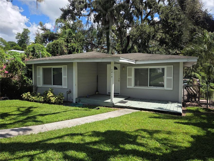FIXER UPPER in charming Old Seminole Heights Bungalow on a quiet street! This 2 bedroom 1 bathroom 764 square foot  home is ready for your own personal touch, tlc & elbow grease. It welcomes you with a beautiful tree lined street on the sidewalk to the quaint front porch. Access the private driveway on the side, you will find a storage shed in the back that can also be used as a workshop. The large privacy fenced backyard is the perfect retreat where you'll find a large deck prefect for entertaining, relaxing, or grilling outdoors with your friends and family! Inside you will find a living room with lots of natural light. The eat-in kitchen has plenty of cabinet space including a  pantry closet.  PRIME LOCATION with less then 2 miles from Zoo Tampa and Seminole Height's favorite parks, markets, restaurants, and bars. Only 15 min from downtown TPA, and 20 Mins from TPA International Airport.