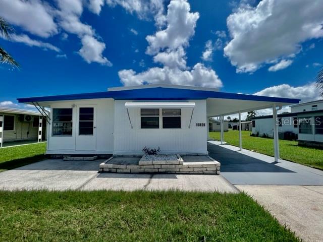 WELCOME TO YOUR SUPER HOME at 10826 Tioga Dr, Port Richey in the gated community of Senate Manor, a 55+ cooperative community in SUNNY Florida. This 1973 lovely 1 bedroom + large FL room (easy 2nd bedroom), 1 bathroom RENOVATED mobile home lies on a nice lot with over 4000 sqft in a NO CDD zone. Key exterior features are covered carport parking, 2 entrances into the home, rain gutters & easy-breezy TROPICAL landscaping with a pair of MAJESTIC palm trees framing the LOVELY HOME. More PHENOMENAL features are hurricane shutter for some of the windows, vinyl base skirting around the perimeter to prevent unwanted critters & a wide open yard to design your OUTDOOR DREAM OASIS. When you step inside, you'll LOVE the OPEN FLOOR PLAN consisting of the eat-in-kitchen, living & dining rooms & SPACIOUS Florida room. This REMODELED HOME is NEW, FRESH & READY FOR THE LUCKY BUYER! The water-resistant floors are dressed with laminate throughout the home for fluidity of design. The custom kitchen features a stainless steel double sink, solid wood cabinets with handles, expansive laminate counters & updated appliances including a smooth-top glass range, range vent & fridge. NATURAL SUNSHINE streams inside through the multiple windows ILLUMINATING the interior together with light fixtures. The primary bedroom can fit queen-size furniture & has a fan & ample closet space with 6-panel sliding closet doors. The generous-sized NEW bathroom features plentiful storage options, NEW vanity with cultured marble counter & OVERSIZED step-in shower with shelving. The Florida room with built-in AC UNIT can be set up as a 2nd bedroom & adds 140 sqft to home for a heated/cooled area of 692 sqft not reflected in public records. The laundry room with WASHER & DRYER INCLUDED & bonus utility sink is located in storage shed/workshop area. TWO, ENERGY-EFFICIENT, MINI-SPLIT AC SYSTEMS with remote control cool the home & provide heat on the cooler nights. One mini-split system is located in the living room while the other is in the primary bedroom. This home did sustain flooding from Hurricane Helene. The owner had it expertly remodeled using the services of a licensed contractor who pulled the proper county permits for the renovation. All permits have been closed out by the county with a final inspection & the mobile passed county inspection. This AMAZING home is better than it ever was before & ready for immediate enjoyment! Senate Manor is a WONDEFUL 55+ COMMUNITY & included in the low HOA fee of $200/month is trash with recycling pick-up 2X week, all exterior lawn maintenance, water, sewer, street lights, water with fountain views, gates & recreational activities like HEATED POOL & SPA, shuffleboard, horseshoes & gym. There is optional storage for boats, RVs or trailers on site. Location is IDEAL near beaches, shopping, restaurants, medical plazas, places of worship & tourist attractions. MAKE THIS YOUR FUTURE HOME!