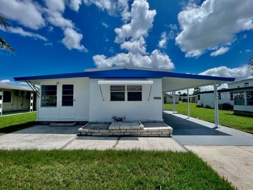 WELCOME TO YOUR SUPER HOME at 10826 Tioga Dr, Port Richey in the gated community of Senate Manor, a 55+ cooperative community in SUNNY Florida. This 1973 lovely 1 bedroom + large FL room (easy 2nd bedroom), 1 bathroom RENOVATED mobile home lies on a nice lot with over 4000 sqft in a NO CDD zone. Key exterior features are covered carport parking, 2 entrances into the home, rain gutters & easy-breezy TROPICAL landscaping with a pair of MAJESTIC palm trees framing the LOVELY HOME. More PHENOMENAL features are hurricane shutter for some of the windows, vinyl base skirting around the perimeter to prevent unwanted critters & a wide open yard to design your OUTDOOR DREAM OASIS. When you step inside, you'll LOVE the OPEN FLOOR PLAN consisting of the eat-in-kitchen, living & dining rooms & SPACIOUS Florida room. This REMODELED HOME is NEW, FRESH & READY FOR THE LUCKY BUYER! The water-resistant floors are dressed with laminate throughout the home for fluidity of design. The custom kitchen features a stainless steel double sink, solid wood cabinets with handles, expansive laminate counters & updated appliances including a smooth-top glass range, range vent & fridge. NATURAL SUNSHINE streams inside through the multiple windows ILLUMINATING the interior together with light fixtures. The primary bedroom can fit queen-size furniture & has a fan & ample closet space with 6-panel sliding closet doors. The generous-sized NEW bathroom features plentiful storage options, NEW vanity with cultured marble counter & OVERSIZED step-in shower with shelving. The Florida room with built-in AC UNIT can be set up as a 2nd bedroom & adds 140 sqft to home for a heated/cooled area of 692 sqft not reflected in public records. The laundry room with WASHER & DRYER INCLUDED & bonus utility sink is located in storage shed/workshop area. TWO, ENERGY-EFFICIENT, MINI-SPLIT AC SYSTEMS with remote control cool the home & provide heat on the cooler nights. One mini-split system is located in the living room while the other is in the primary bedroom. This home did sustain flooding from Hurricane Helene. The owner had it expertly remodeled using the services of a licensed contractor who pulled the proper county permits for the renovation. All permits have been closed out by the county with a final inspection & the mobile passed county inspection. This AMAZING home is better than it ever was before & ready for immediate enjoyment! Senate Manor is a WONDEFUL 55+ COMMUNITY & included in the low HOA fee of $200/month is trash with recycling pick-up 2X week, all exterior lawn maintenance, water, sewer, street lights, water with fountain views, gates & recreational activities like HEATED POOL & SPA, shuffleboard, horseshoes & gym. There is optional storage for boats, RVs or trailers on site. Location is IDEAL near beaches, shopping, restaurants, medical plazas, places of worship & tourist attractions. MAKE THIS YOUR FUTURE HOME!