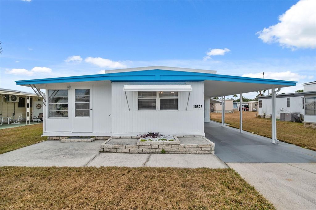 Photo of 10826 Tioga Drive, Port Richey, FL 34668 (MLS # W7877272)