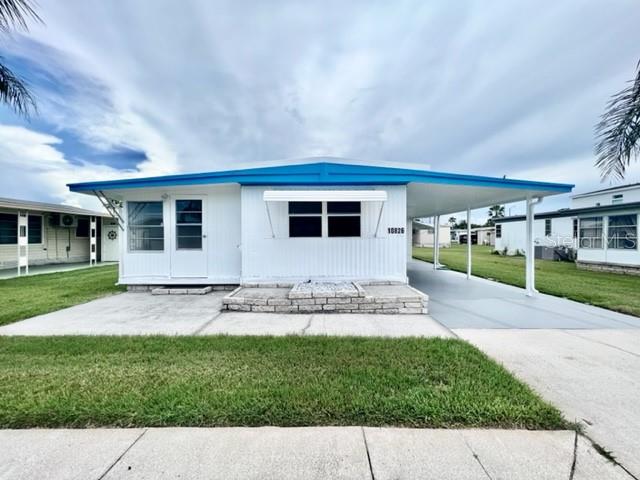 WELCOME TO YOUR SUPER HOME at 10826 Tioga Dr, Port Richey in the gated community of Senate Manor, a 55+ cooperative community in SUNNY Florida. This 1973 lovely 1 bedroom + large FL room (easy 2nd bedroom), 1 bathroom RENOVATED mobile home lies on a nice lot with over 4000 sqft in a NO CDD zone. Key exterior features are covered carport parking, 2 entrances into the home, rain gutters & easy-breezy TROPICAL landscaping with a pair of MAJESTIC palm trees framing the LOVELY HOME. More PHENOMENAL features are hurricane shutter for some of the windows, vinyl base skirting around the perimeter to prevent unwanted critters & a wide open yard to design your OUTDOOR DREAM OASIS. When you step inside, you'll LOVE the OPEN FLOOR PLAN consisting of the eat-in-kitchen, living & dining rooms & SPACIOUS Florida room. This REMODELED HOME is NEW, FRESH & READY FOR THE LUCKY BUYER! The water-resistant floors are dressed with laminate throughout the home for fluidity of design. The custom kitchen features a stainless steel double sink, solid wood cabinets with handles, expansive laminate counters & updated appliances including a smooth-top glass range, range vent & fridge. NATURAL SUNSHINE streams inside through the multiple windows ILLUMINATING the interior together with light fixtures. The primary bedroom can fit queen-size furniture & has a fan & ample closet space with 6-panel sliding closet doors. The generous-sized NEW bathroom features plentiful storage options, NEW vanity with cultured marble counter & OVERSIZED step-in shower with shelving. The Florida room with built-in AC UNIT can be set up as a 2nd bedroom & adds 140 sqft to home for a heated/cooled area of 692 sqft not reflected in public records. The laundry room with bonus utility sink is located in storage shed/workshop area. TWO, ENERGY-EFFICIENT, MINI-SPLIT AC SYSTEMS with remote control cool the home & provide heat on the cooler nights. One mini-split system is located in the living room while the other is in the primary bedroom. This home did sustain flooding from Hurricane Helene. The owner had it expertly remodeled using the services of a licensed contractor who pulled the proper county permits for the renovation. All permits have been closed out by the county with a final inspection & the mobile passed county inspection. This AMAZING home is better than it ever was before & ready for immediate enjoyment! Senate Manor is a WONDEFUL 55+ COMMUNITY & included in the low HOA fee of $200/month is trash with recycling pick-up 2X week, all exterior lawn maintenance, water, sewer, street lights, water with fountain views, gates & recreational activities like HEATED POOL & SPA, shuffleboard, horseshoes & gym. There is optional storage for boats, RVs or trailers on site. Location is IDEAL near beaches, shopping, restaurants, medical plazas, places of worship & tourist attractions. MAKE THIS YOUR FUTURE HOME!