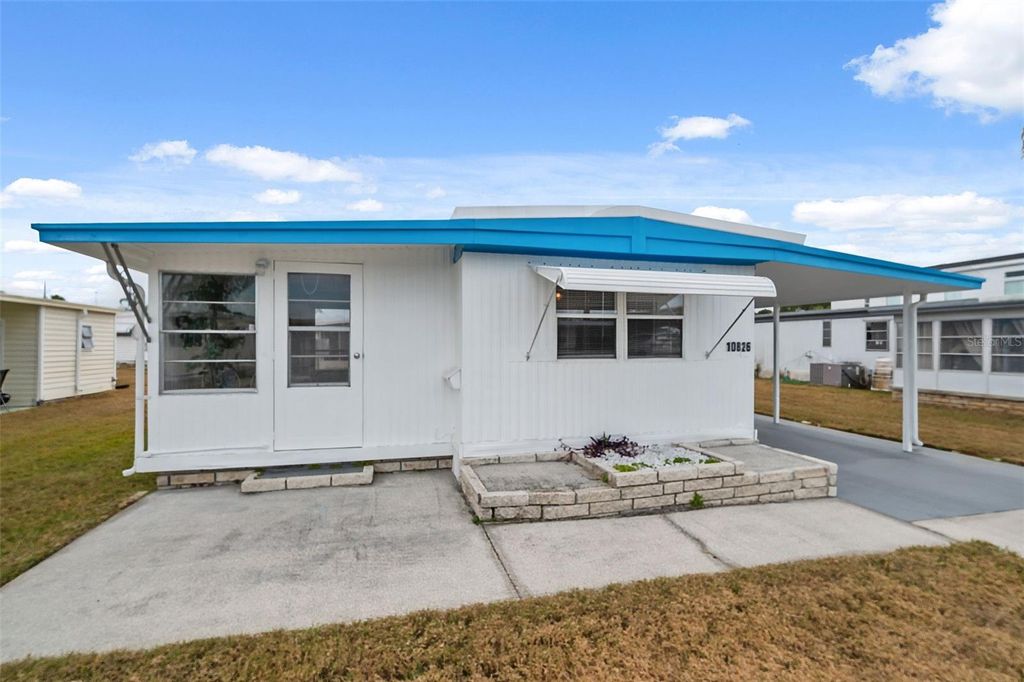 Photo of 10826 Tioga Drive, Port Richey, FL 34668 (MLS # W7877272)