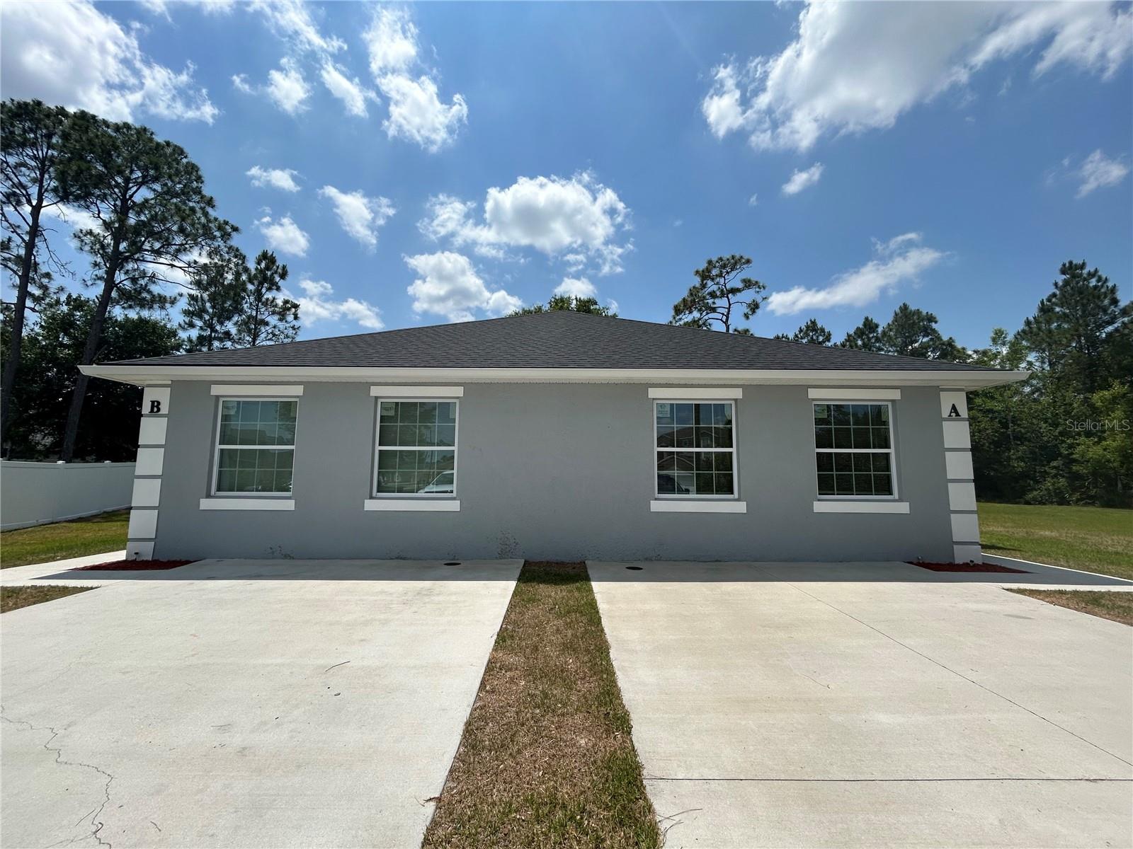 Welcome home to 817 Savona Place Unit A in Kissimmee, a beautifully renovated 3 bedroom, 2 bath duplex home! Upon entering, you are welcomed into the spacious open floorplan living space, overlooking the kitchen and dining area. Enjoy plenty of natural light through the home. The kitchen features a full suite of stainless steel appliances, including the refrigerator, range, over the range microwave, dishwasher as well as plenty of cabinetry and counter top space. The primary bedroom is spacious, featuring a walk in closet and private access to the beautifully renovated primary bath, with a dual vanity and walk in shower. Both additional bedrooms are well sized, with easy access to the second full bath featuring a shower tub combo. Rounding out this home is the interior laundry room, equipped with hookups to accommodate for a full sized washer and dryer. Lawn service is included! 8x8 shed, available for tenant use.