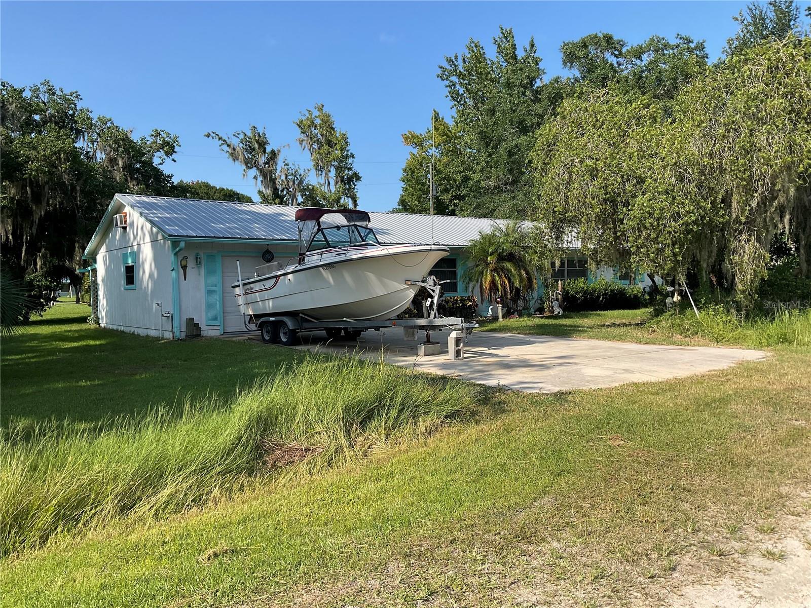 River Life Awaits in Crescent City!
Escape to the peace and beauty of Old Florida living with this charming 3 Bedroom, 1 Bath block home complete with a spacious 600 sqft. 2-Car Garage and your very own boat slip on the legendary St. Johns River! Solid block construction, Oversized 2-car garage (approx. 600 sqft), Private boat slip – perfect for fishing & boating adventures, Quiet country setting with gorgeous natural surroundings. Located near golf, spring-fed swimming, hiking, camping & more!
Whether you’re searching for a weekend getaway, a full-time home, or a smart investment property, this Crescent City gem checks every box. Imagine mornings on the water, afternoons exploring nature, and evenings soaking in the peaceful river lifestyle.
Don’t miss your chance to own a slice of Florida paradise with river access!