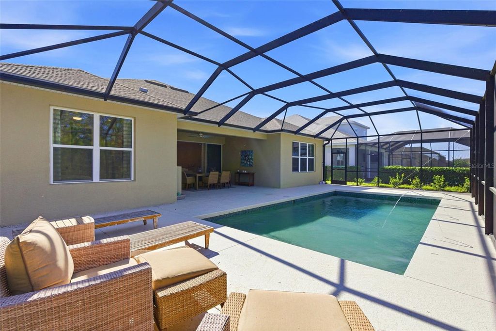 Photo of 33332 Castaway Loop, Wesley Chapel, FL 33543 (MLS # TB8471441)