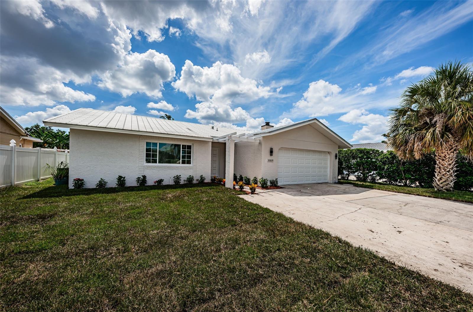 Total renovation including kitchen, flooring, drywall, doors, baseboards, bathrooms, painting inside and out, fixtures and ceiling fans! Over $90,000 in renovations! Great floor plan kitchen open to the family room with high ceilings!! Screened porch from family room to backyard. Metal roof replaced 2014. Central heat & air 2016! Utilities are underground.