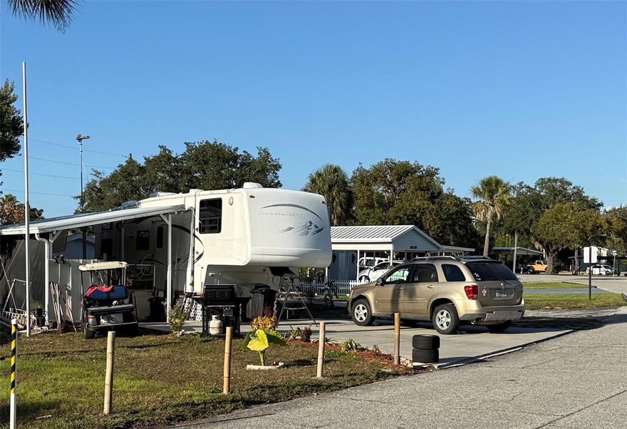 61x162x132 Deeded Lot, 50x10 Cement Pad with 12x24 Patio, 2005 5th wheel is included with the lot. Travel Trailer, Motor Home or Park Model. 10x9 Shed with Washer & Toilet. Horseshoes, Tennis, Community Pool, Miniature Golf, Shuffle Board, Basketball Court, Pickleball and much more. Dues include Water & Sewer, trash pickup & lawn maintenance from April 1 to October 1. Free internet at the clubhouse, free storage (subject to availability and upon request) for RV, Boat, Trailer etc.