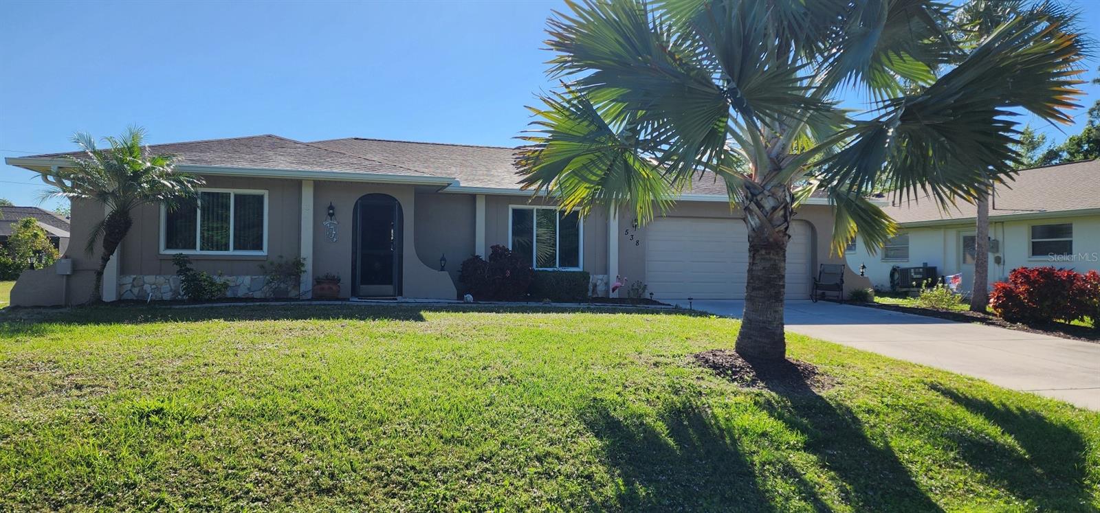Start Living the Florida Lifestyle in this Beautiful & Affordable 2 Bedroom, 2 Bath, oversized 2 Car Garage Furnished Pool Home. Pride of ownership shows as you pull up to this Gorgeous Landscaped Pool Home. As you walk through the screened front porch....you will feel a sense of paradise with the awesome views of your Huge Private Sparkling Heated Pool. Living room features vaulted ceiling and nice size window looking out to the luxurious landscaped yard. Kitchen and Dining room features: pocket sliding glass doors that open into the lanai/pool area that makes this an awesome house for entertaining. The Kitchen has plenty of counterspace and cabinets and includes all the appliances and the microwave being brand new. Guest Bedroom is nice size. Guest bathroom has a tub/shower combo with nice tile walls. Primary bedroom is huge with archway opening overlooking the primary bathroom and mini pocket sliding glass door out to your private pool/lanai area. Primary bathroom has dual sinks and separate room with a walk-in shower with glass doors and toilet area. Other features of this Beautiful Furnished Pool Home includes: tile flooring throughout, ceiling fans, hurricane impact windows, hurricane garage door, EzMax removable hurricane shutters for the lanai area, all exterior doors have been replaced, new A/C, newer roof, new pool pump and pool heater, painted inside and out about 3 years ago, oversized garage with workshop area and laundry area towards the back of garage and more.....Enjoy relaxing in your screen/covered lanai that is very spacious with 3 ceiling fans to help keep you cool as well as the huge sparkling swimming pool overlooking the well maintained landscaped backyard. Just minutes away from Kiwanis Park that is a dog friendly park with fitness/walking trails, play ground, picnic facilities, pavilion and stunning nature preserves. Also nearby: Port Charlotte Beach Complex with boat ramp, park, community pool and more, shopping, restaurants, golf, fishing, Gulf beaches and the list goes on...... Great Location!! Great Curb Appeal!! Great Price!! Underground utilities recently completed in this area. Don't miss the boat on this one...Start Living the Florida Lifestyle Now.... Call today for your private showing.