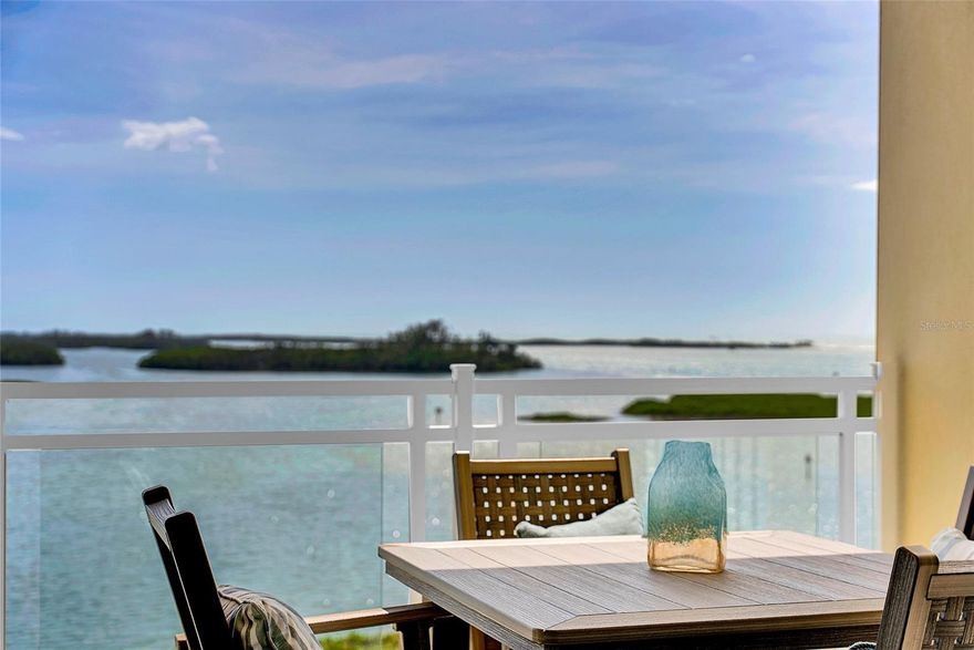 Nestled within the newest building of Sunset Pointe at Collany Key built in 2022, this breathtaking 5th-floor condominium offers one of the largest floor plans available, perfectly positioned in Building 4 to capture some of the most stunning views this exclusive, gated beachfront community has to offer. Step into your sanctuary via a semi-private elevator, leading to a private foyer that introduces you to a residence that feels more like a home. This exquisite 3-bedroom, 3.5-bath condo boasts expansive open water views of the Gulf and the vibrant coastal wildlife, perfectly complemented by a 2-car private garage and climate controlled storage unit. Impeccably designed with numerous upgrades, this unit is a showcase of sophisticated living. Enjoy the serenity of upgraded soundproofing, the elegance of Cortec wide plank flooring, and the functionality of upgraded white shaker solid wood cabinetry. A coordinating wine bar with refrigeration, Sub Zero and Wolf stainless steel appliances, and custom lighting enhance this exquisite condo. Additional features such as remote blinds, custom closet systems, electric hurricane shutters, coffered ceilings, 2 spacious balconies and gorgeous coastal modern designer details round out this home's interior charm. For those seeking convenience, this residence is available fully "turn key." Sunset Pointe welcomes pets and offers an array of exclusive resort-style amenities all situated on an 18-acre private island. Enjoy private beach access, a state-of-the-art fitness center, a geo-thermo pool & spa, gas fire pits, kayak storage with a floating launch dock, a fishing dock, Bocce Ball, a sunset pavilion, and a putting green. Experience a lifestyle of luxury and comfort at Sunset Pointe in Collany Key, where every detail is designed to offer the ultimate in coastal living conveniently located just minutes to downtown St Petersburg and 40 minutes to Tampa International.