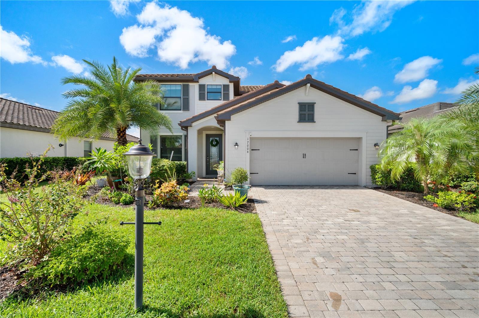Welcome home to beautiful Polo Run at Lakewood Ranch! (The #1 master planned community in the United States.) Polo Run is gated and maintenance. Located on a highly desirable waterfront this spectacular home lot is loaded with features and upgrades including a gorgeous paver driveway and lanai, as well as a tiled roof. Featuring an open concept design, it is perfect for the homeowner who loves to cook or entertain. The luxurious kitchen features all stainless-steel appliances, gorgeous granite countertops and large island for additional kitchen seating and entertaing. The open floor plan of the living/breakfast nook/kitchen area opens up to a screened-in lanai with a scenic overlook of a small lake and with no rear neighbors. The primary suite, overlooking the lake, features a massive walk-in closet. The primary bathroom has a fully tiled, walk-in shower, with glass entry, double bowl vanity, and an additional linen closet. Two additional spacious bedrooms are also on the second floor, with walk in closets. A second bathroom between the two bedrooms features a shower/tub combo. Additionally, the second floor has another living space/bonus room perfect for relaxing and hanging out with friends and family. The fourth bedroom and third bathroom located on the first floor are ideal for guests. The first floor also features flex space near the front of the home that could serve as a home office or formal dining room. The home also features a laundry room with appliances that will convey with the home. The two car garage offers plenty of room for two vehicles and additional storage. The exterior of the home also features lush tropical landscaping that add to the ambience of paradise in your own yard. The home also features a large fenced in area in the back yard with a wrought iron fence. Polo Run at Lakewood Ranch community amenities boast a clubhouse, pickleball and tennis courts, basketball court, an exercise facility, and aerobics room, resort style pool, dog park, playground/tot lot and walking paths to keep you active all year-round. Highly desired Polo Run at Lakewood Ranch is amenity rich with surprisingly low HOA fees. It is zoned for A+ rated schools, and near Lakewood Ranch Main Street, shopping at UTC, medical facilities, Sarasota Polo Club, top rated golf courses, international airports, MLB spring training sites, beautiful area beaches, county and state parks.