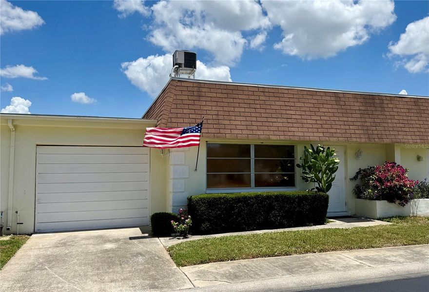Wonderful opportunity to be the new owner in one of Pinellas County’s elite 55+ active communities. The property features an airy, open-concept layout that seamlessly connects the living, dining, and kitchen areas. Brand new carpet throughout and move in ready! It also includes a versatile Florida/bonus room—perfect for an office or guest space—and a one-car garage for parking and storage. Residents enjoy resort-style amenities, such as an inground pool, a spacious clubhouse, and shuffleboard courts. For a hassle-free lifestyle, the condo association fee covers cable, internet, yard maintenance, exterior insurance, flood insurance, and roof maintenance. The location offers easy access to Tampa, St. Petersburg, major highways, and our world-famous Sugar Sand beaches.