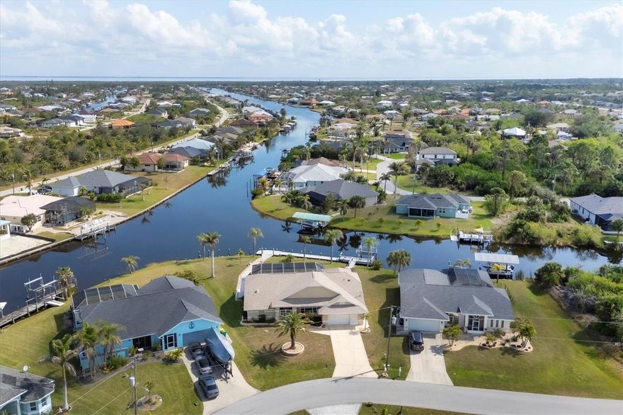This charming waterfront residence sits on a 16,820-square-foot lot featuring expansive intersecting waterway views and direct Gulf access, making this 3-bedroom, 2.5-bath home a truly rare find. Properties offering this caliber of views, this price point, and such quick, unobstructed access to the lagoon are exceptionally limited. Adding to its appeal, the home is perfectly situated just minutes from Boca Grande’s pristine beaches, boutique shopping, and renowned restaurants, offering the ideal blend of coastal lifestyle, convenience, and tranquility.

Enjoy Florida’s best boating lifestyle with an almost 100-foot dock, additional pilings, and a 10,000 lb boat lift with electric and water. Step inside through the screened double-door entry to find an inviting space with vaulted ceilings, expansive sliding glass doors, and a spacious layout that seamlessly blends indoor and outdoor living. The eat-in kitchen and formal dining area offer plenty of room for entertaining, while the large primary suite features direct pool access, a walk-in shower, and a Jacuzzi tub.

The guest bedrooms are well-appointed and separated by a guest bath, plus there’s a renovated pool bathroom for added convenience. Outside, enjoy a sparkling pool and spa, a brand-new 2023 pool cage, and a 2024 pool heater, all overlooking the water. The lushly landscaped grounds include paver walkways leading down to the dock.

Additional updates include a 2022 pool pump, 2022 garage door, and 2024 refrigerator. If you're looking for a well-loved home with character in a prime waterfront location, this is it!
