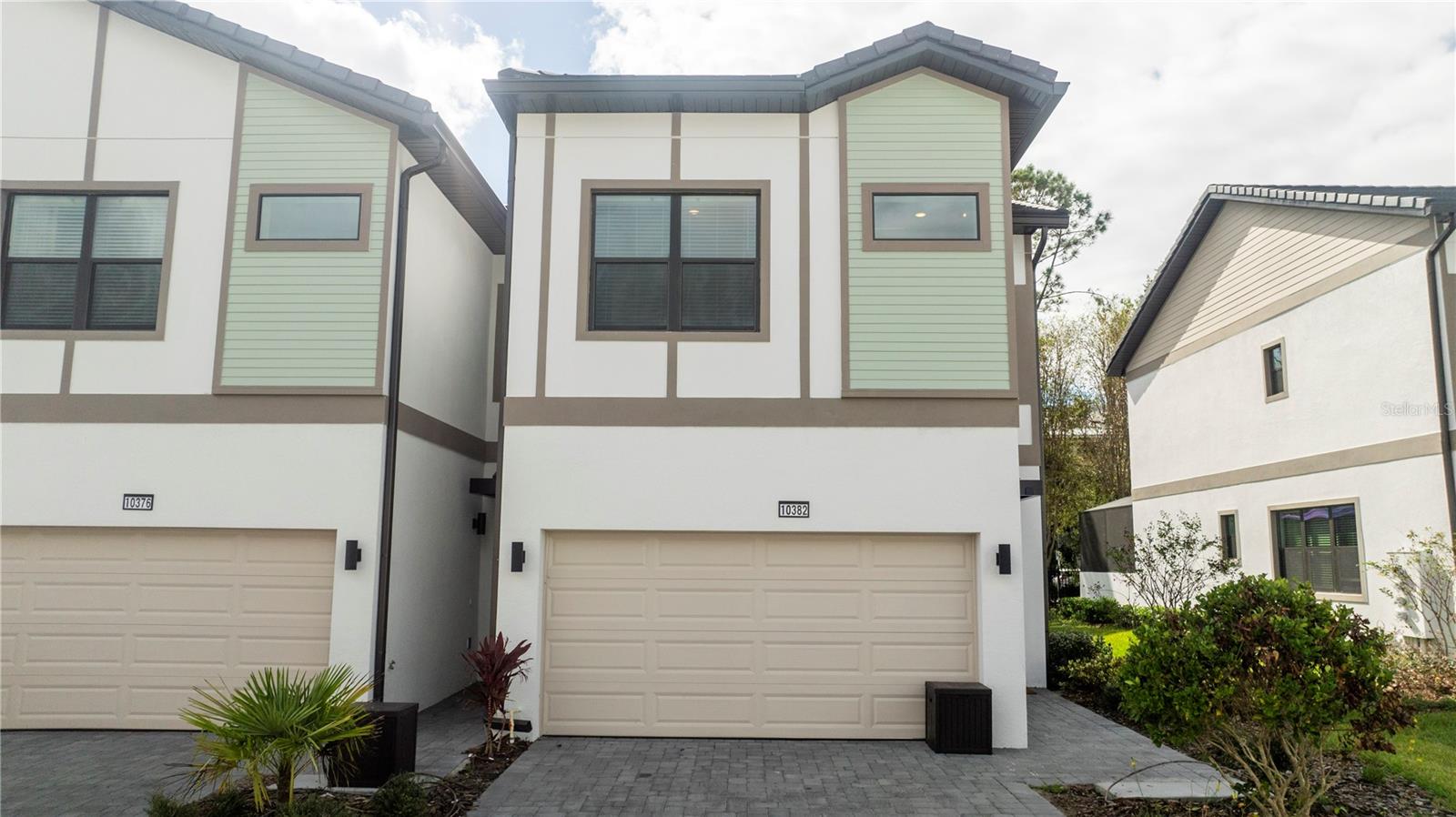 WHY WAIT FOR A NEW CONSTRUCTION WHEN YOU CAN BUY A BRAND NEW CORNER TOWNHOME AND FULLY FURNISHED/DECORATED BY A PROFESSIONAL INTERIOR DESIGNER? Discover the epitome of luxury vacation in Orlando with the unparalleled HOTTEST VACATION COMMUNITY by Park Square Homes. Embrace the mantra of LOCATION, LOCATION, LOCATION as this stunning property offers a prime location, just a short drive away from SeaWorld, Disney, Universal, premium outlets, and a delectable array of restaurants. A buyers favorite, the Nautilus floor plan, features 5 bedrooms, 5 bathrooms. Dive into the refreshing waters of your own private heated pool. The Townhome is also equipped with an EV car charger. Enjoy the resort-style living with exclusive access to the Aquarius Clubhouse, featuring an amazing pool, lazy river, game room, café, and fitness center. This is not just a home; it's a lifestyle. DON'T MISS THE OPPORTUNITY to make this yours, as it's certain not to last! Seize the chance to own a piece of luxury living in the heart of Orlando.