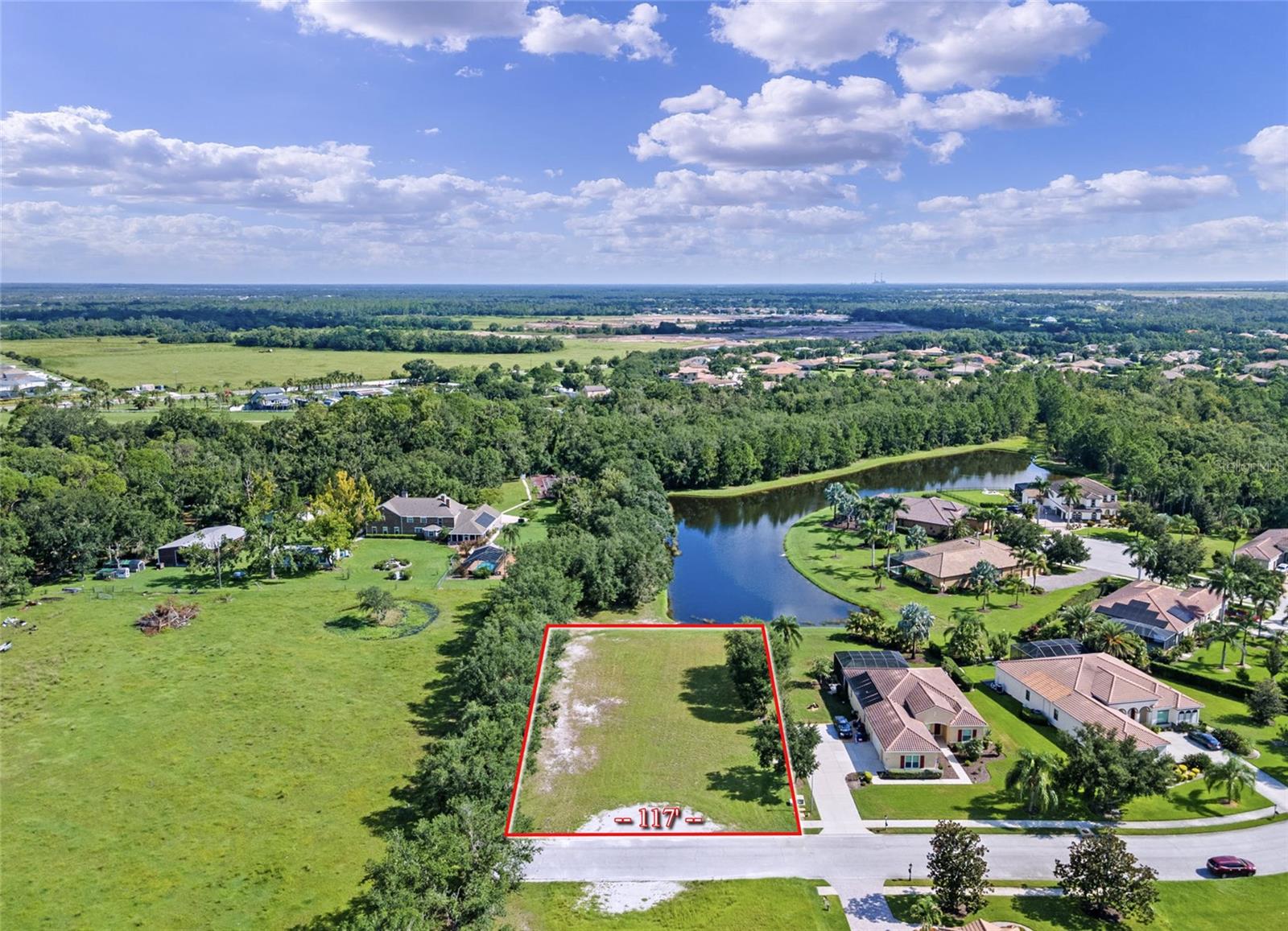 Don’t miss this exceptional opportunity to own one of the last remaining ½+ acre waterfront lots in the prestigious Rye Wilderness Estates. Perfectly situated at the end of a dead-end street, this incredible property offers expansive water views and conservation to the west, creating a private and serene backdrop for your custom dream home. With ample space to design a sprawling estate-style residence, the lot easily accommodates expansive outdoor living areas, a resort-style pool, and a spacious 3-car (or larger) garage—all while maintaining generous yard space. Buyers have the flexibility to choose their own builder, and custom home builder recommendations are available upon request. Rye Wilderness Estates is renowned for its estate-sized lots, high-end custom homes, and community charm that preserves long-term value. Enjoy the peace of a low-density neighborhood with no CDD fees and low HOA dues, all while being just a short drive to top shopping destinations like UTC Mall and Ellenton Outlets, premier dining, the Manatee River, State Parks, and Gulf Coast beaches. Build your forever home in one of the most desirable communities in the region!