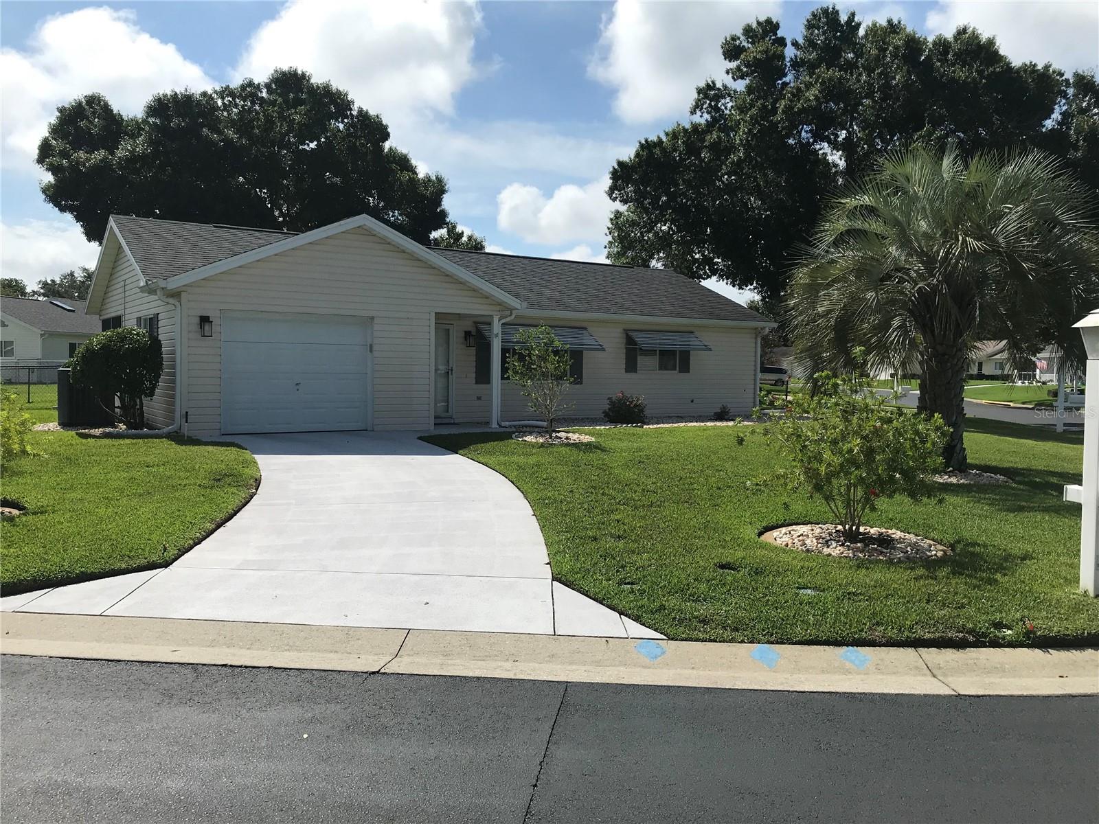 CHARMING HOME LOCATED IN GOLF COURSE COMMUNITY! Located in the vibrant 55+ community of Spruce Creek Preserve. This home sits on a gorgeous corner lot! Some of this homes’ thoughtful details include walk in bedroom closets, laminate flooring, ceiling fans throughout and window blinds throughout. Kitchen is open to the dining area. The lanai has sliding windows, it opens to a huge 11’ x 35’ concrete patio perfect to enjoy grilling outdoors. The backyard has a chain link fence, perfect for a furry friend.. New asphalt roof shingles were installed in 2016. For a full price offer, SELLER agrees to provide BUYER with a Home Warranty policy for all appliances only. Spruce Creek Preserve has many updated amenities. The community has a heated pool and whirlpool spa, tennis courts, pickle ball courts, bocce courts, shuffle board, craft rooms, billiards and library. This community has so many clubs and activities for a truly enjoyable Florida retirement lifestyle. Make an appointment to see this home today.