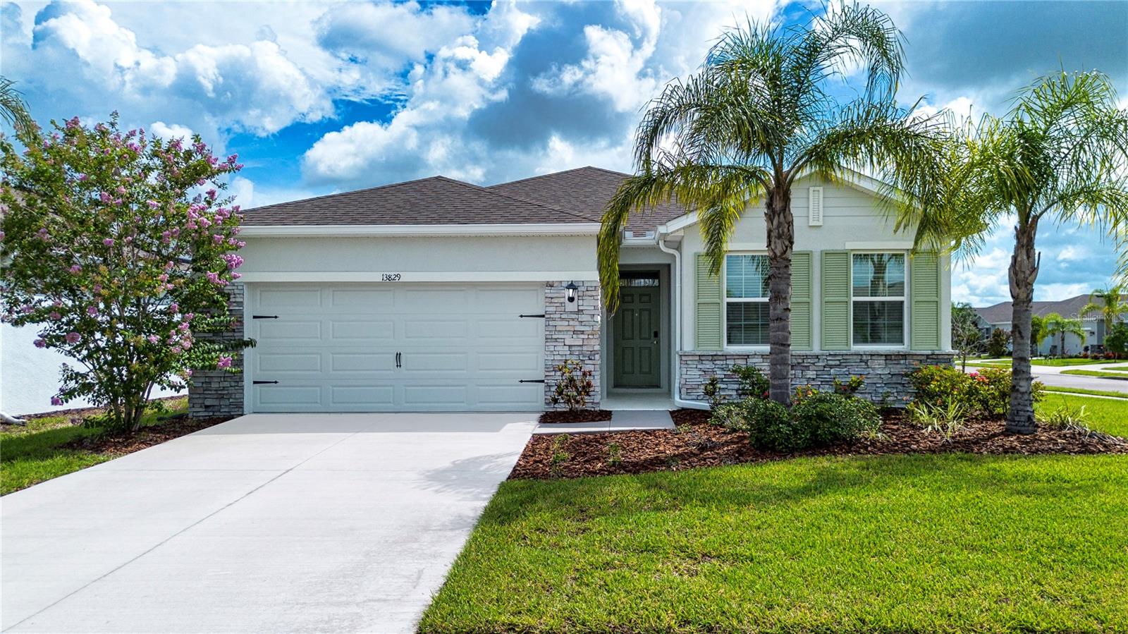 Outstanding Value in Lakewood Ranch – $425,000! Only 5 years young! Don’t miss this incredible opportunity to own a beautifully maintained 4-bedroom, 2-bath single-family home in one of the most desirable gated communities in Lakewood Ranch! Built in 2020, this home is move-in ready and offers the perfect blend of style, space, and convenience. Step inside to discover a spacious, open-concept layout with ceramic tile flooring throughout the main living areas and plush carpet in the bedrooms. The gourmet kitchen is a true standout, featuring white upgraded cabinetry, modern tile backsplash, stainless steel appliances, a breakfast bar, and designer light fixtures—all adding to the home’s fresh and stylish appeal. The generous primary suite includes dual walk-in closets and a private bath with a double-sink vanity and glass-enclosed, ceramic tile shower—a serene retreat at the end of the day. Enjoy access to the community’s resort-style pool & fitness center and take advantage of included lawn care as part of the low HOA. All located just minutes from Lakewood Ranch Blvd, SR-70, I-75, Lakewood Ranch Main Street, UTC Mall and world-renowned Gulf Coast beaches. Whether you're a first-time buyer, snowbird, or investor—this is a rare find in a prime location. Schedule your showing today!