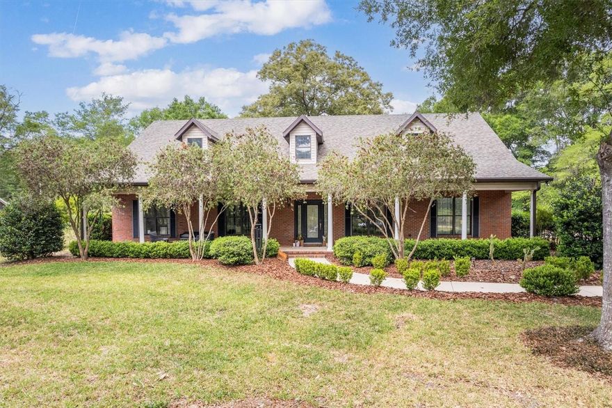 Gorgeous home on 2.17-acres…in SW Gainesville!  Located just east of Parker Road and moments from Archer Road, this property provides the perfect balance of beauty, privacy, functionality, and convenience. The home features 3 bedrooms, 2 baths plus an office space, an cathedral ceilings in the great room, rich wood flooring throughout the main living areas, an oversized, attached garage, and a gas fireplace for chilly nights!  The oversized, attached garage boasts its own half-bath, cleanup after enjoying the property is a breeze!  Designed for both everyday living and for entertaining your friends and family, the open-concept layout seamlessly connects the great room, kitchen, and dining areas and gives direct access to the lanai and the outdoor spa!  The kitchen is a standout, featuring stone countertops, GE appliance suite, abundant cabinetry, AND a large, walk-in pantry. The spacious primary suite is a private retreat, complete with a spa-like tub, a walk-in shower, and an oversized closet large enough for changing!  Outdoor living truly shines, featuring both a shady front porch and a large, rear lanai leading to the Jacuzzi spa…perfect for relaxing afternoons or cool evening soaks. 
The fully fenced property is thoughtfully equipped with large front and rear parking areas, well and septic systems, a whole-house generator, and two propane tanks. Electric infrastructure extends across much of the property, offering exceptional flexibility and convenience for whatever you may pursue. Major improvements include a NEW ROOF (2024) two NEW well pumps,delivering peace of mind for the new owners.  A true highlight is the impressive 50’ x 50’ metal building with concrete flooring, large exhaust fan, and multiple RV hookups—including the ability to park an RV inside the building.  It is ideal for a workshop, storage, hobbies, or for housing recreational equipment—this is a valuable feature that sets this property apart from the others.  This is a unique opportunity to own a property with NO HOA that delivers space, versatility, and lifestyle—all in a prime SW Gainesville location. Enjoy an easy commute to UF, UF