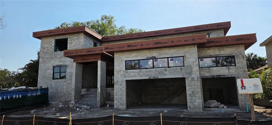 Under Construction. This masterfully crafted custom home offers 5,331 sf of air-conditioned living space, anchored by a first-floor primary suite and waterfall staircase with glass railing. The layout includes 6 bedrooms and a den. One bedroom could be a flex space suited for a gym, media room or bonus room.  The home offers 6 full baths, half bath plus pool bath, with upstairs and downstairs laundry rooms.

The gourmet kitchen is built around a Viking 48" induction range with brass accents, paired with a full Viking appliance suite including column refrigerator and freezer, convection drawer microwave, and integrated dishwasher. Cabinetry features walnut lowers with glass front walnut uppers in charcoal accents, a canvas-colored refrigerator wall,  with a charcoal island topped with Level 5 quartz.  Haute Frank Lloyd Wright fixtures by Brizo in Luxe Gold, a 36" workstation sink, pot filler, and travertine surround complete the space.

The great room features a custom walnut built-in with a 52" Modern Flames electric fireplace coupled with the adjacent dining room dry bar with a built-in Viking 24" wine column and patina brass chandelier.

The primary bathroom retreat offers a walk-in shower with 67" freestanding soaking tub, draped with chevron tile floors, a 21" Frank Lloyd Wright Brizo rainhead, and dual walnut vanities — all finished in polished nickel and teak wood hardware. Every secondary bath carries its own distinct tile and finish story.

Outside, on the spacious lanai, a fully equipped outdoor kitchen — Blaze 32" propane grill, outdoor fridge, drop-in sink, and custom 42" vent hood — anchors the entertaining space alongside the beautiful in-ground pool on a large lot, great for entertaining family and friends!

Located on beautiful Davis Islands, enjoy walkability and golf-cart access to village shops and dining, waterfront parks, bike paths, tennis courts, dog parks, marina, beach, and the historic public pool—just minutes to Downtown Tampa, Water Street, Sparkman Wharf, Tampa General Hospital, and the Riverwalk, with convenient access to Tampa International Airport.