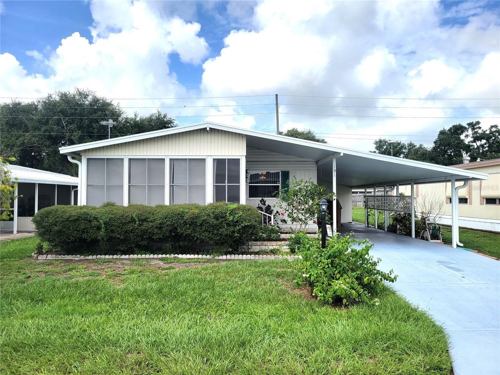 LOOK NO FURTHER!!! 2Bed/2Bath located in a fabulous 55+ gated CO-OP community in Winter Haven. The community provides a lifestyle tailored to active older adults. Pool, Clubhouse, Horseshoes, Billiards, Mini Golf, Shuffleboard, Fishing, Bingo, Arts & Crafts are just a few of the many amenities you'll enjoy. The home features NEW FLOORING, walk-in closets in both bedrooms, the ac, roof, hot water heater, washer & dryer & windows in the florida room were replaced in 2019. Your monthly association fee is only $281 and INCLUDES Spectrum high speed internet, cable tv, trash pick-up and amenities. There's NO LOT RENT, as you own a share of the community! Located close to shopping, dining, hospital, parks and lakes. Call today for a private showing THIS ONE WON'T LAST!
