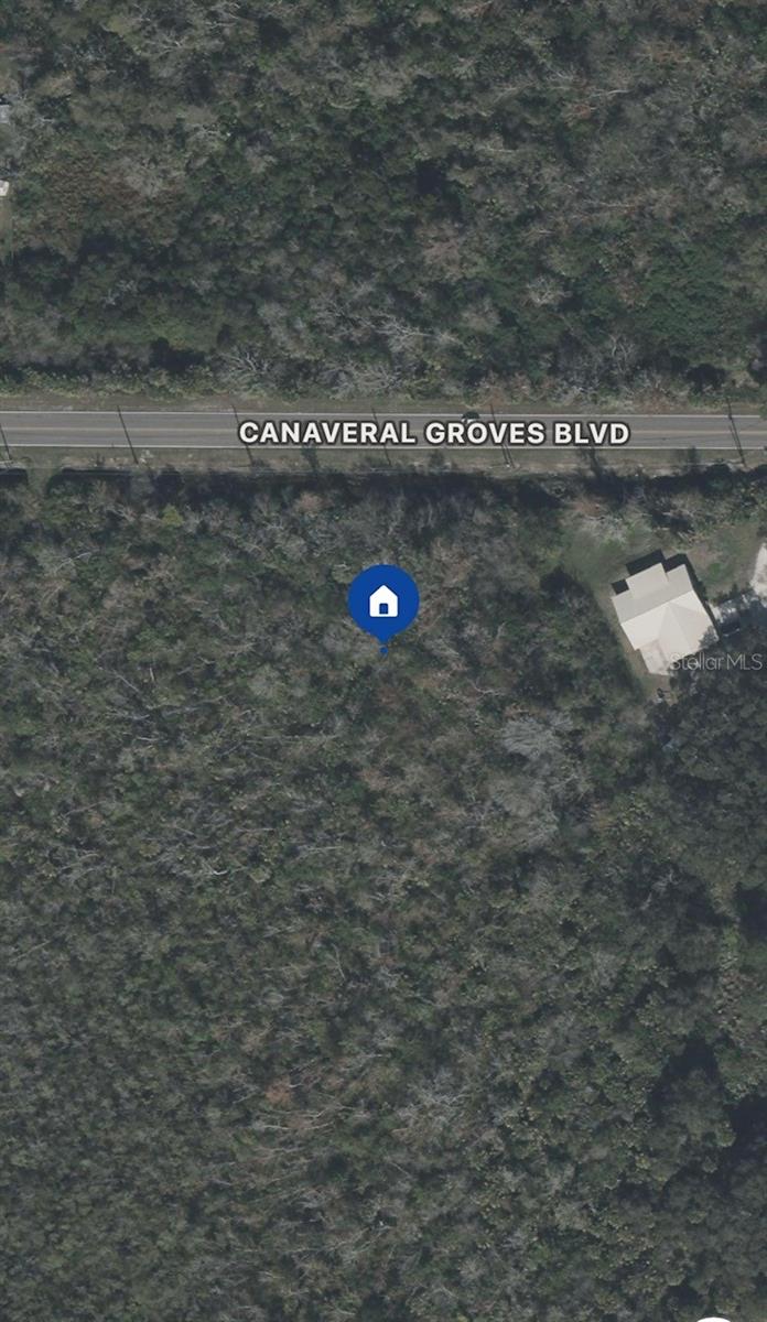 Discover the perfect opportunity to build your dream home on this sprawling 1-acre lot located in the sought-after Canaveral Groves community. With no HOA and plenty of space for your vision, this parcel offers endless possibilities—bring your custom home plans, RV, boat, or even a detached workshop. Surrounded by natural Florida beauty, this property provides a peaceful, country feel while still offering convenient access to I-95, beaches, shopping, and dining. Whether you're looking to build now or invest in land for the future, this is a prime piece of real estate on Florida's Space Coast!