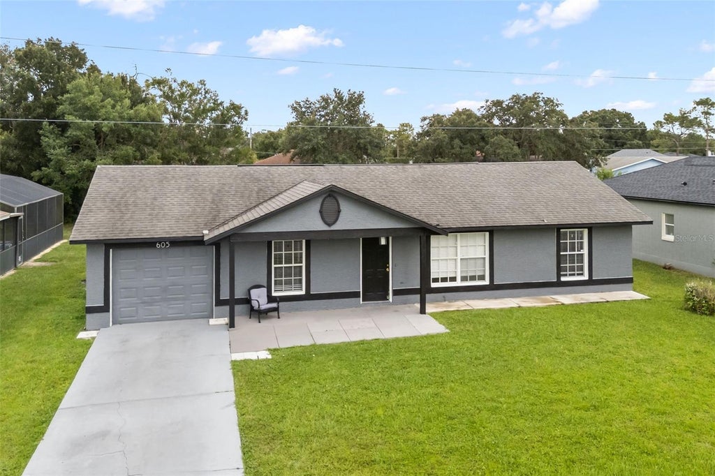 Photo of 605 Tamarin Lane, Kissimmee, FL 34759 (MLS # O6438836)