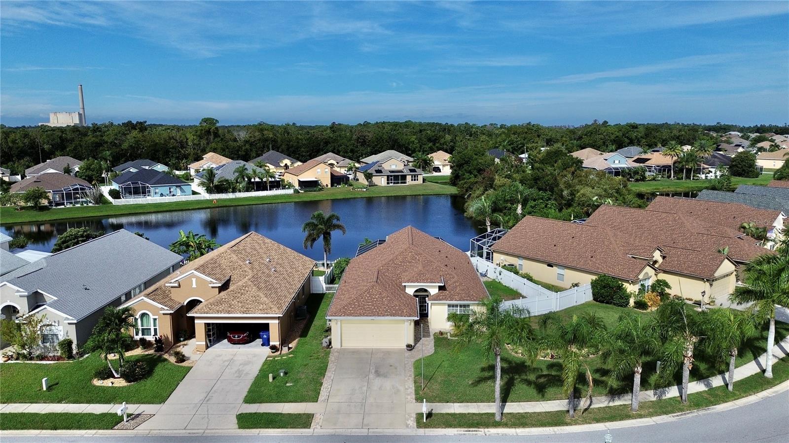 One or more photo(s) has been virtually staged. Light, bright, and airy, this rare Key Vista home offers a private POOL on a WATER LOT plus a versatile bonus room that can serve as an office, den, playroom, or 4TH BEDROOM. Still near the OCEAN! (see the pictures for proximity to ocean) The split-plan layout provides 3 bedrooms, 2 baths, an open design ideal for entertaining, and a screened lanai overlooking the pool and lake—perfect for enjoying Florida sunsets. Inside laundry with utility sink and a 2-car garage add convenience, while the large curved lot with mature palms enhances curb appeal. Updates noted herein are provided to the best of our belief but may not be exact; buyer must verify at buyer’s expense: Roof (2023), AC (2018), Hot Water Heater (2024), solar-heated pool, kitchen cabinets refaced, primary bath upgraded with dual-head double shower, pool screening, PVC fencing, and sprinkler system. BELIEVED NON-FLOOD X ZONE. Community amenities include a clubhouse, resort-style pool and spa, gym, game room, tennis, playground, and RV/boat parking. Nearby are Key Vista Nature Park, Anclote Gulf Park, Pinellas Trail, dog parks, golf, recreation center, Tarpon Springs Sponge Docks, shopping, dining, and world-class beaches from Sunset Beach to Clearwater. No HOA approval required, and rentals allowed immediately. Approx. 30 minutes to Tampa International Airport. Estate sale—no seller disclosures provided. All information believed accurate but not guaranteed; buyer must verify all facts at buyer’s expense. COME SEE THE HOME AT THE "FIRST LOOK SHOWING" HOUSE EXPECTED TO SELL QUICKLY!