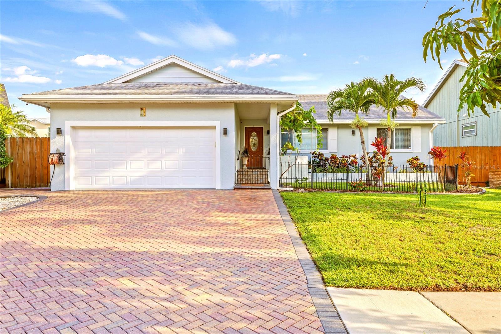 LOCATION AT IT'S BEST, NEAR TO GOLF COURSE AND ZONED FOR THE BEST RATED SCHOOLS IN PINELLAS COUNTY. STAYED STRONG & NEVER DAMAGED OR FLOODED BY RECENT HURRICANES, SOLID BLOCK HOME WITH HEATED & SALT POOL IS LOCATED IN THE MOST DESIRABLE PINE LAKE NEIGHBORHOOD & BAYWOOD VILLAGE WITH GOLF COMMUNITY & NO HOA FEES. Welcome to this magnificent, immaculate, FULLY UPDATED, with the highest & best quality 4 Beds/ 2 Baths/ 2 Car Garages/POOL, 2200 SQFT under the roof! Upon your private front porch surrounded by fruit trees, mango, grapes vine & mature landscaping in the front relaxing courtyard, you will notice the finest interior features, including the porcelain tiles through the entire house, Vaulted Ceilings, Modern Light Fixtures, Crown Molding with the accent Natural Stone wall, built on Electric Fireplace that it can be moved on different area .A superior Chief's Signature Pearl Kitchen offers Granite Countertops, Glass Backsplash, Plenty of Cabinets with soft close drawers, high end SS Appliances, stylish Range Hood, Conventional Oven & Microwave built in. The oversized kitchen & dining room with a big sitting ISLAND built in more storages & rack wine, serves as a breakfast bar/ dining table and creates a long linear open floor plan that leads through the door into the paradise vinyl fenced backyard. This Home features a primary bedroom with ensuite bath & fully luxury ensuite bathroom. 2 split bedrooms have a big closet and the fourth bedroom you can use as an office, guest room or den. THE UPGRADES ARE ENDLESS, NEW HVAC (2024), ROOF (2018), WATER HEATER (2020), NEW PAINT INTERIOR/ EXTERIOR, NEW HEAT SALT POOL PUMP & SOLAR COVER. NEW ELECTRICAL, PLUMBING, ATTIC INSULATION, RECESSED LIGHTS, BLINDS & SHADES, NEW IMPACT WINDOWS, WATER SOFTENER. The garage has many cabinets built in and is customized with plenty of storages you can park your golf card and much more. LAUNDRY ROOM WITH FRONT LOAD WASHER AND DRYER / PEDESTALS is custom built with more cabinets. Designed to optimize the neutral light, the residence illuminates warmth and provides the ultimate space for entertaining indoors and out with a gorgeous deck built in/outdoor BBQ Grill and mini fridge. Enjoy the spacious screened pool and different sitting patios with pavers all way, low maintenance yard work, this house brings it all, wonderful location, centrally located, close to shopping, dining, marinas, and our wonderful beaches and a short drive to: Safety Harbor, Clearwater, Dunedin, Tarpon & Pinellas Bike Trail. Home homeowner insurance is around $ 2500/ year. Flood Insurance $1750. Schedule a showing of this stunning house today! BRING YOUR OFFERS!
