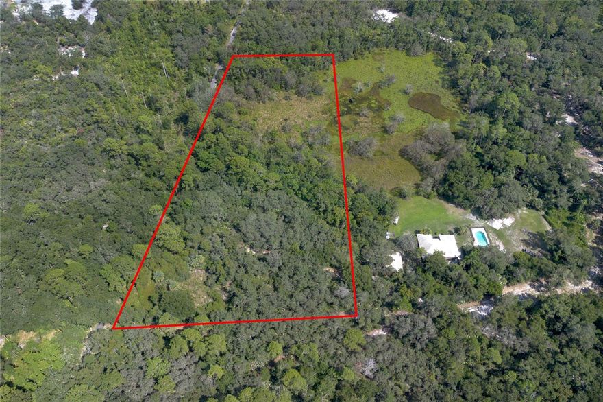 Welcome to your dream homesite! This stunning 4.5 acre parcel of vacant land offers the perfect blend of privacy, natural beauty, and
convenience. Tucked away between Sanford and New Smyrna Beach, this expansive property is completely private at the end of a private road!  It runs parallel to the paved bike path, making new adventures available every day! Whether
you're envisioning a cozy cabin, a modern farmhouse, or a luxury estate, this land provides a blank canvas in an idyllic setting. Enjoy the
tranquility of country living with the bonus of being just a short drive from shopping, dining, and major roadways. You’ll feel worlds away while
still being conveniently located to all the essentials.