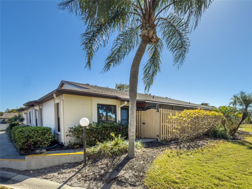 This beautifully updated, mostly furnished, villa offers a perfect blend of comfort and style, featuring a modern kitchen with brand-new cabinets and sleek quartz countertops, a large pass through to the dining room, ideal for everyday living and entertaining. Enjoy peace of mind with a new A/C system, elegant porcelain floors throughout, and a thoughtfully designed layout that feels open and inviting. Step outside to a large private lanai—perfect for relaxing or dining al fresco—while still enjoying a quiet, private setting just steps from the community clubhouse and pool. A rare combination of privacy, upgrades, and convenience. There is an assigned carport space and guest parking close to the unit. This villa is ready for you to call home, even if it’s part time. It's located in a very active 55+ community with many amenities for your enjoyment and social life. Country Village has been a popular place to live with most residents staying for many years. There is a comforting sense of happiness and an abundant list of activities if you choose to participate. Enjoy the large, heated pool, spa, pool tables, exercise equipment, library, bingo, shuffleboard, outdoor grilling area, on site management, library, etc. Owners are allowed one small pet no more than 30 pounds. Country Village offers a full calendar of activities year-round. All amenities are within a few minutes drive. This includes houses of worship, restaurants, hospitals, airports, major highways, entertainment, many stores, etc. Major airports are within approximately an hour drive, also professional sports, world class rowing, malls, popular beaches, etc. This includes Anna Marie Island, Siesta Beach, Lido Beach, St Armand's and Lakewood Ranch. Disney, Orlando, Sanibel Island are all approximately a ninety-minute drive. If you want to relax and enjoy the beautiful sunsets, you are a short ten-minute drive from the Gulf of Mexico Beaches. If you want to fish and/or go boating, water access is a few minutes drive. Kayaking and Jet skiing is also available. This unit is a must see if you are shopping for a bargain in West Bradenton close to recreational activities and all amenities. Come see what paradise has to offer! Schedule a preview of this unit now! This will not last long!