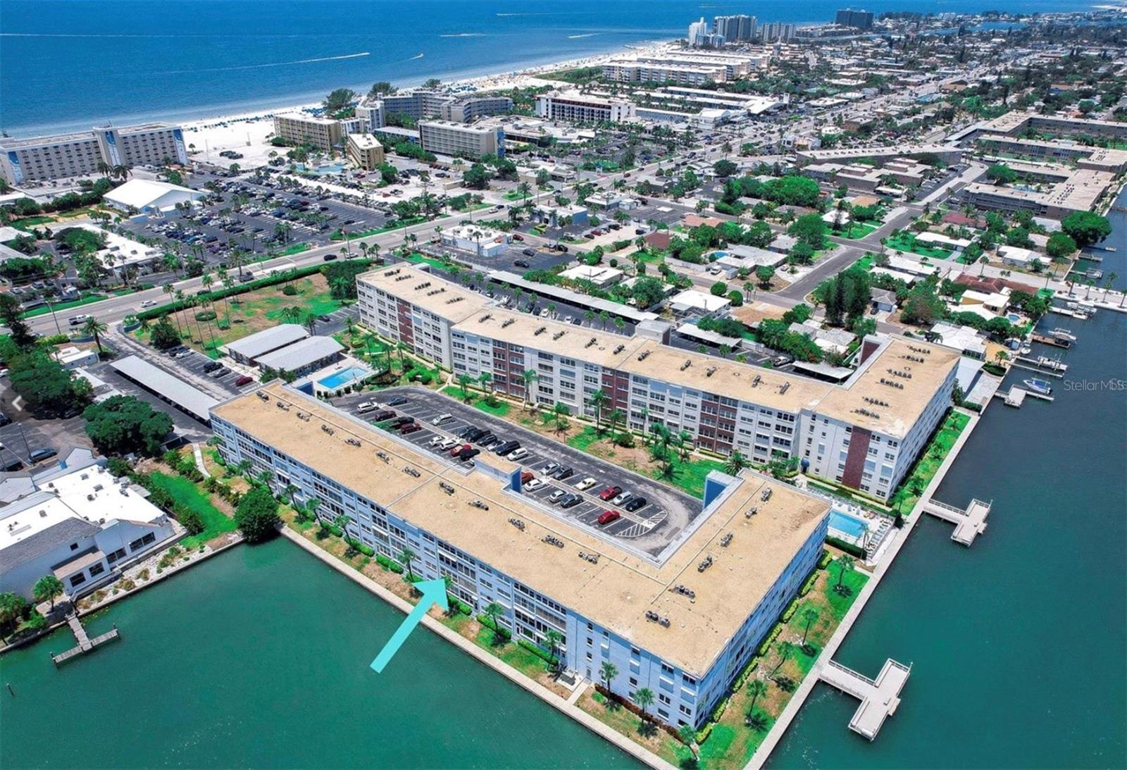 STUNNING WATER VIEW..... Newly remodeled St. Pete Beach 3rd Floor Condo without the Beachfront Price. Walk across to the Beach, Tradewinds Beach Resort, Restaurants, Bars and Stores. This Gorgeous, FULLY and NEWLY remodeled in 2022, 3rd floor condo located in the popular Regency West Condo on Gulf Blvd, features a stunning Waterview, new A/C system, new shaker style kitchen cabinets with stainless steel Whirlpool appliances (dishwasher, range, refrigerator and microwave hood), granite countertops, subway tile backsplash, new fixtures and lighting, additional counterspace and cabinet in dining area. The enclosed sunroom has a direct waterfront view as well as storage area. The 2nd bonus room is not fully enclosed can be used as a den or 2nd bedroom. The Master bedroom has a walk in closet and a half bath. New light grey waterproof floors LVP throughout with new plank ceramic tile in both bathrooms. Bathrooms feature newer vanities, fixtures, and toilets. This great community features 2 saltwater pools, furnished outside Patio, Fishing piers, shuffleboard, fitness room, dedicated locked storage area and Bike/Kayak shed, 1 designated parking spot and guest parking and the laundry room is conveniently right outside your front door. The exterior of the entire community is being meticulously maintained, and it has been recently painted. 2024 New Roof installed – assessments paid in full. The building also features an elevator. Leasing Restrictions, no more than one lease a year with 90 day minimum. Now is your chance to be an owner in a very popular building where Units are rarely for sale. The beach is right across the street