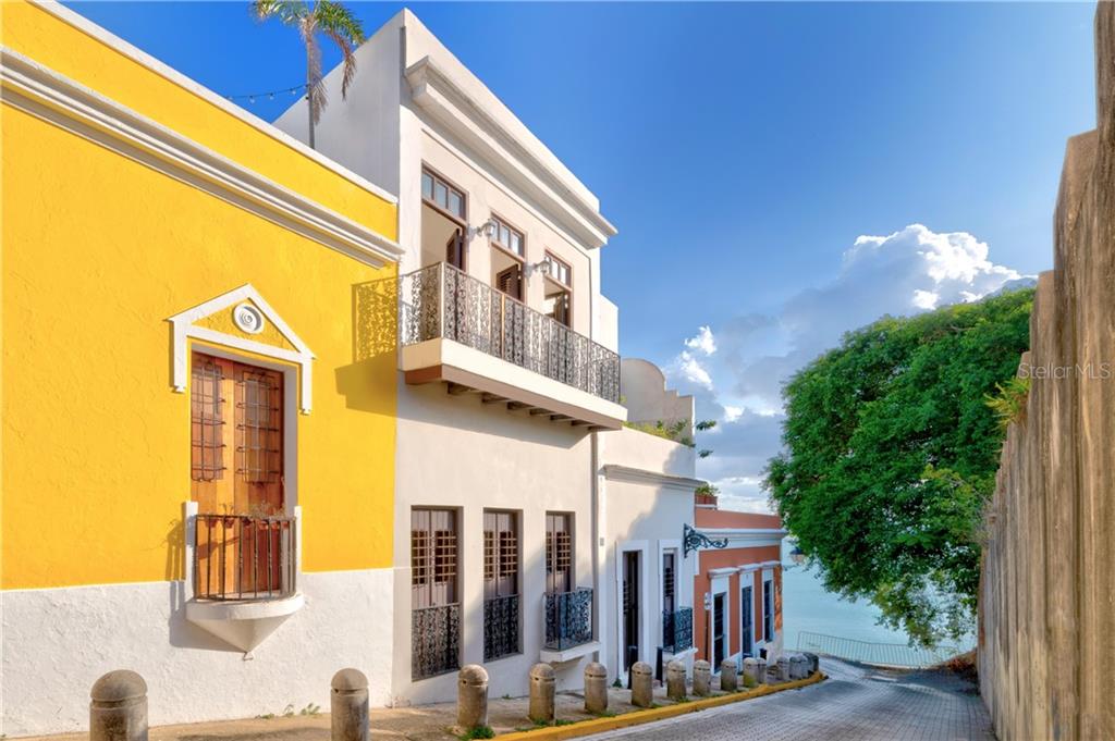 This splendid 6 bedroom, 3-level residence includes a private rooftop terrace providing unobstructed views of the San Juan bay. Across from this magnificent home you can look into the gardens of "La Casa Blanca", once home of Spanish conquistador Juan Ponce de Leon. This magnificent home was renovated in 2012. Additional features include balconies in each room and or step out terraces that make up for approximately 2,481 Sq ft . Ensuite bathrooms in four bedrooms. A separate entrance on Rafael Cordero St. accessed through the basement will lead you through a small courtyard where you will find two bedrooms with one bathroom.
On the first floor you have the receiving area, living room, two bedrooms with ensuite bathrooms. The second floor is the dining area and open concept kitchen, with balconies, powder room and two bedrooms.
Enjoy the breathtaking views from the rooftop terrace and watch the Sunset.
Pedestrian friendly and rich in culture, Old San Juan celebrates the Old World with its charming Spanish architecture. Enjoy a stroll to historical sites such as Castillo San Felipe Del Morro, and La Fortaleza, on the list of UNESCO World Heritage.
Walk to the finest restaurants in the area and enjoy living in this historical city.
Showings by appointment only.