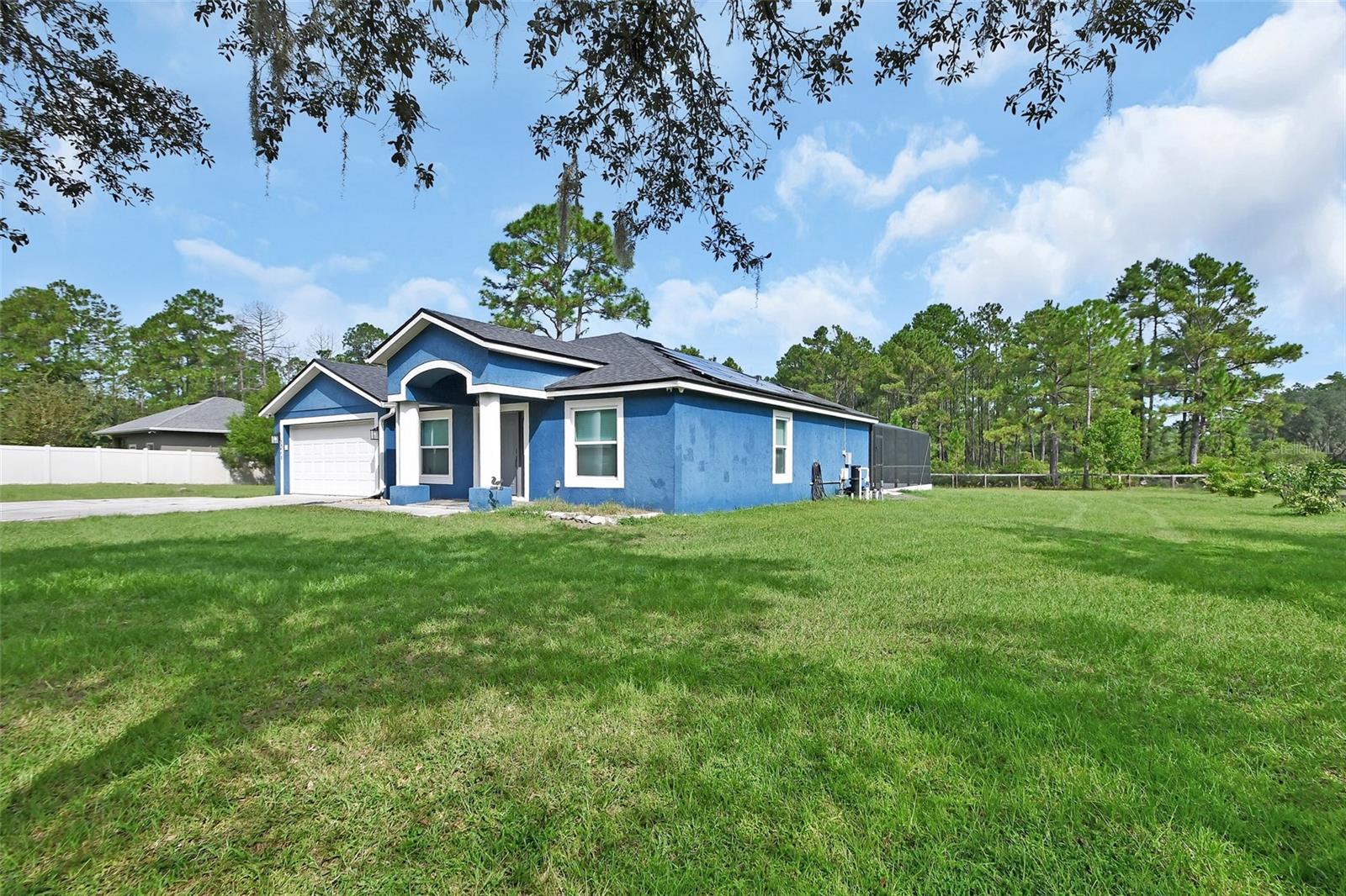 Where can you find a completely remodeled pool home on a one acre, fenced yard for under $500,000?!?! Well, here it is! This 3-bedroom, 2-bathroom, 2-car garage, pool home offers everything you could need! It has a NEW designer style kitchen with quartz counter tops and NEW appliances. The master bathroom has a beautifully designed walk-in shower, dual vanities and walk-in closet! There is NEW LPV flooring throughout the home with wood tile in the spare bedrooms. The roof is a 2022 with PAID OFF solar panels so your power bill will be cheap-cheap! Outside the NEW triple slider doors, you will find the NEW enclosed pool with a sundeck! This home offers so many NEW features its crazy! Oh, I forgot to mention, all the windows are NEW!!! Come check it out!