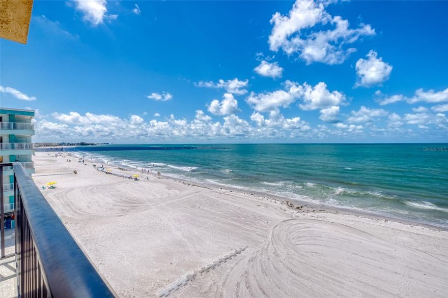 This exceptional 2-bedroom, 2-bath Gulf Front condominium offers breathtaking direct views of the Gulf of Mexico and picturesque coastline vistas of Madeira Beach. The floor plan is thoughtfully designed, differing from typical beach condos, allowing expansive beach views and sunsets to be appreciated from the open kitchen, dining, living area, and both bedrooms. Features include newer sliding glass doors with impact glass, custom curtains, an updated kitchen, and a well-planned layout with an in-unit washer and dryer. The minimal rental period of seven days enhances its appeal as a second home with potential income. The Trillium is a small complex comprising only 15 units, providing amenities such as a heated pool and secure lobby, conveniently located a short distance from the renowned Johns Pass.  Great income potential!