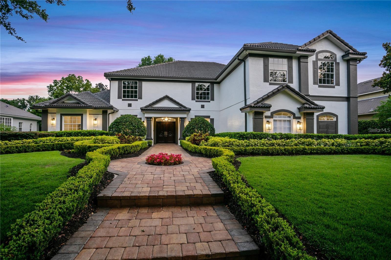 Experience Refined Luxury in the Heart of Dr. Phillips
Welcome to a stunningly reimagined estate in the highly sought-after Palm Lake gated community—an exclusive enclave of just 39 luxury homes in one of Orlando’s most prestigious neighborhoods.
This move-in ready, 5-bedroom, 4.5-bathroom estate with a spacious upstairs bonus room offers over-the-top elegance and comfort. From the moment you arrive, you’re greeted by immaculate curb appeal—lush, manicured landscaping, a stately paver driveway, and an inviting façade that sets the tone for what lies within.
Step inside the grand foyer and be instantly impressed by luxury flooring, a designer chandelier, and seamless sightlines that draw you into the heart of the home. The formal living room features uninterrupted views of the resort-style pool, while the elegant dining room and private home office are adorned with custom lighting and refined finishes—ideal for entertaining or working in style.
The chef-inspired kitchen is the ultimate culinary space, boasting premium KitchenAid appliances, including a double convection oven, induction cooktop, and built-in ice maker. The adjoining family room is bathed in natural light, thanks to soaring transom windows that create a bright and welcoming atmosphere.
Retreat to the first-floor primary suite, a peaceful sanctuary featuring dual walk-in closets and a luxurious, spa-like bathroom with a soaking tub, oversized walk-in shower, dual vanities, and a show-stopping chandelier.
Upstairs, a cozy loft leads to a huge bonus room, pre-wired for surround sound and projector—perfect for your future home theater or game room. Four additional bedrooms, each with access to beautifully appointed bathrooms, provide plenty of space for family or guests.
Outside, the screen-enclosed pool area is your private resort. Enjoy the cascading waterfall, elegant stonework, and multiple lounge areas designed for relaxing or hosting unforgettable gatherings.
Modern smart features—including a Nest thermostat, Cat-5-E wiring, strategically placed access points, Ring video doorbell, security camera system, and a new 2020 pool pump—ensure this home is as functional as it is beautiful.
Thoughtfully upgraded by the original owners, this residence seamlessly blends timeless elegance with Calabasas-inspired luxury, offering a unique lifestyle opportunity in one of Orlando’s most exclusive zip codes.
Don’t miss your chance to own this rare gem—where every detail has been curated for those who demand the very best.
