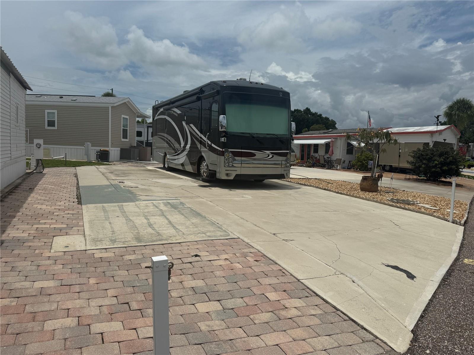 Great opportunity to own a highly sought-after vacant lot in the vibrant, gated 55+ community of Outdoor Resorts at Orlando. This resort-style, lakefront neighborhood offers the perfect blend of relaxation and recreation, ideal for both seasonal visitors and year-round residents. The community features 979 individually owned lots, with a mix of vacant parcels, park models, and RVs. This rare vacant lot provides the flexibility to bring your RV or place a park model customized to your needs. Residents enjoy an impressive range of amenities, including a free 9-hole par-3 golf course, two heated swimming pools, lighted tennis and pickleball courts, shuffleboard, horseshoes, and a clubhouse with regular social events and activities. Conveniently located near grocery stores, restaurants, medical facilities, theme parks, and major shopping centers, Outdoor Resorts at Orlando puts everything you need within easy reach.