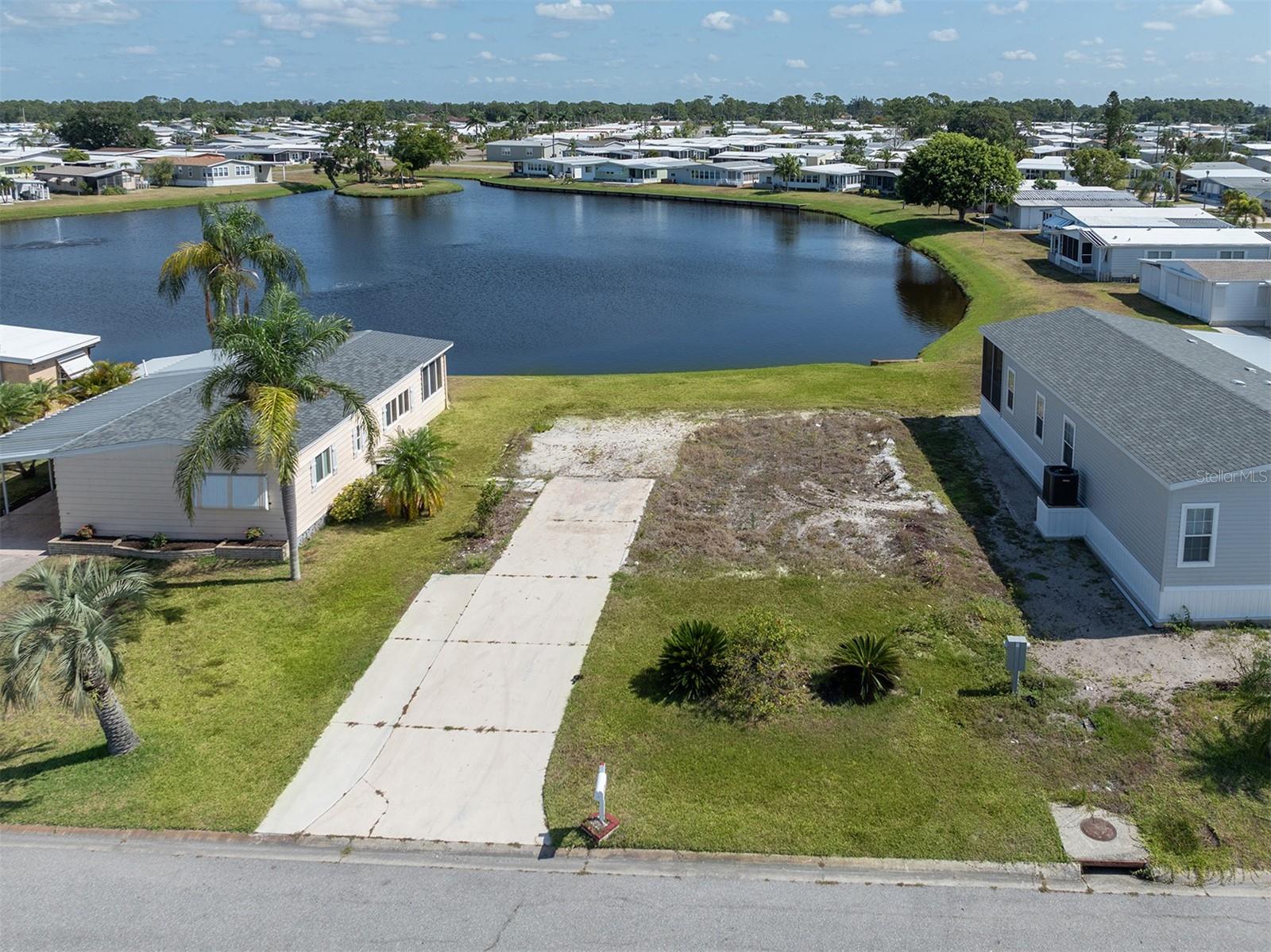 Rarely available lakefront lot to put a new home on in the premier, land owned, pet friendly, 55+ community of Harbor Isles. Five star resort like amenities and activities are available year round. Easy access to beaches, shopping, dining, Braves ball field, interstate, airports and more. Don't miss out on owning in popular Harbor Isles. Building packages available.