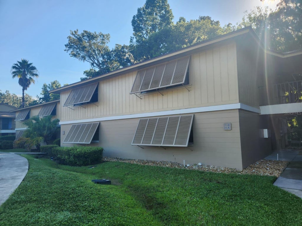 Photo of 130 Jasmine Woods Ct #11B, Deltona, FL 32725 (MLS # O6442124)
