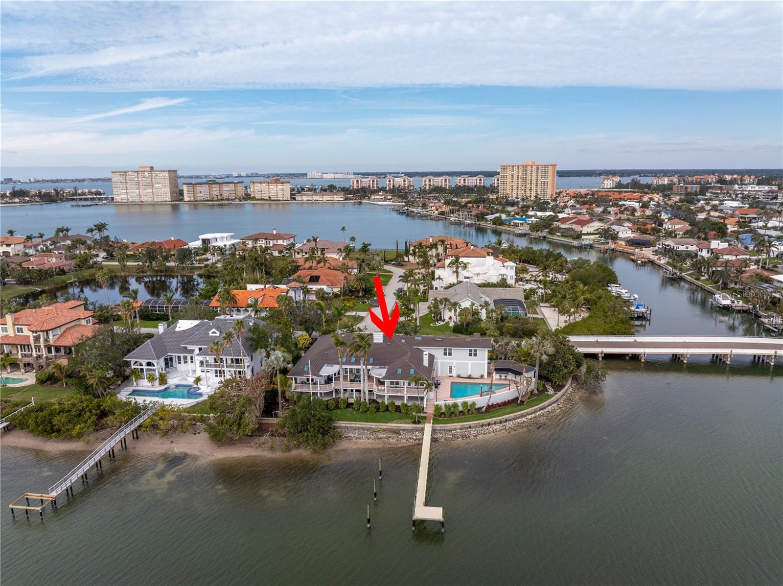 Coastal Elegance Meets Modern Durability in Bayway Isles
Discover the epitome of waterfront living in Bayway Isles, one of Tampa Bay's most prestigious gated communities. This Bahamian-style Colonial home blends timeless sophistication with modern upgrades, offering stunning views of Boca Ciega Bay and the iconic Skyway Bridge.
From the moment you arrive, the property captivates with its dramatic circular drive, fresh landscaping ($40K investment), and a grand covered double-door entry. Inside, the home exudes warmth and luxury, featuring five bedrooms, including a private in-law suite, and five full and one half baths. A private, wood-paneled office with brand-new wood floors and a new door offers a tranquil workspace, while the dining area’s recent updates add to the home’s refined character.
The chef’s kitchen is a culinary dream with granite countertops, a center island, and a breakfast bar that seamlessly connects to the family room. Every window frames breathtaking water views, enhancing the sense of serenity throughout. The expansive first-floor master suite offers private access to the outdoors, 250 feet of seawall, and unparalleled waterfront views.
Step outside into your personal oasis, complete with a sparkling pool, new swings, and meticulously manicured gardens. The spacious outdoor decks and private beach are perfect for launching a kayak or paddleboard, while the 2021-built dock—featuring water and electric hookups—can accommodate a large boat.
Safety and durability are paramount: this home, situated on elevated ground with a low flood insurance premium, withstood Hurricanes Helene and Milton without any damage or insurance claims. Hurricane shutters, Roll-a-Guard systems, and FEMA-compliant construction ensure peace of mind.
Bayway Isles offers convenient access to the Gulf Beaches, downtown St. Petersburg, and I-275. For boating enthusiasts, the property provides deep-water access with no bridges to the Gulf of Mexico.
Don’t miss this extraordinary opportunity to own a coastal retreat that embodies both elegance and resilience. Schedule your private showing today and experience the best of waterfront living!