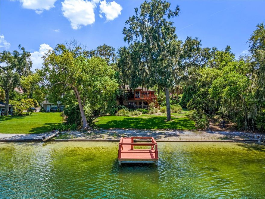 BUYERS FINANCING FELL THROUGH! BACK ON THE MARKET! Prepare to be dazzled by Lake Jennie Jewel nestled on a picturesque tree-lined street on sought-after Gatlin Avenue. You will immediately feel a sense of old Florida in this enchanting home while still be around the corner from modern amenities such as restaurants, retail stores and hiking trails. This two-bedroom, two-bath home plus office boasts 100 feet of stunning lake frontage. Watch Florida’s breathtaking sunsets from your private dock. Lake Jennie Jewel is a spring-fed, skiable 70-acre lake with private boat ramp. The treasure of this home is the panoramic lake views from the primary bedroom, family room and decks. Proximity to downtown Orlando, Disney, downtown business community and central Florida’s top destinations. Zoned for Pershing School and Boone High School. This home is a diamond in the rough, don’t miss out! Call to schedule your private showing today.