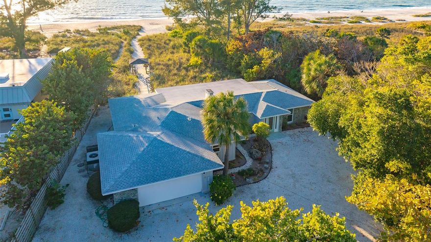 DIRECT BEACHFRONT BEING SOLD AT LAND VALUE! Best beachfront value on the barrier island. This 1.1-acre property on Casey Key features an impressive 100 feet of direct beach frontage, boasting endless sun-kissed days and breathtaking sunsets right from your own backyard. The allure of this property lies in its value - priced to sell below current appraisal. Rarely does an opportunity to own such a large Gulf-side lot become available on Casey Key. Over 390’ of lot depth, deeded bay easement, wide, stable walking beach and 8.34’ elevation add to its appeal. Cherish total privacy on the north side of the lot, which is bordered by the Nokomis Beach State Park and will never be developed. As the largest buildable Gulf front parcel currently on the market, this property presents an exceptional opportunity for those with discerning tastes, offering endless possibilities to create your dream Gulf front luxury home. Currently on the property sits a charming beach cottage, exuding timeless Florida charm while boasting thoughtful updates throughout. Recent renovations include hurricane-impact glass windows and hurricane-code-compliant front and garage doors. Pergo flooring throughout and stylish interior updates make this a comfortable and tranquil beachfront paradise. The home has been continuously occupied, never rented, and lovingly maintained. 
Don't miss out on this extraordinary opportunity to own the best Gulf front land value on Casey Key. Enjoy the coastal lifestyle you've envisioned and come live your dream! Schedule your showing today and make this beachfront sanctuary yours!