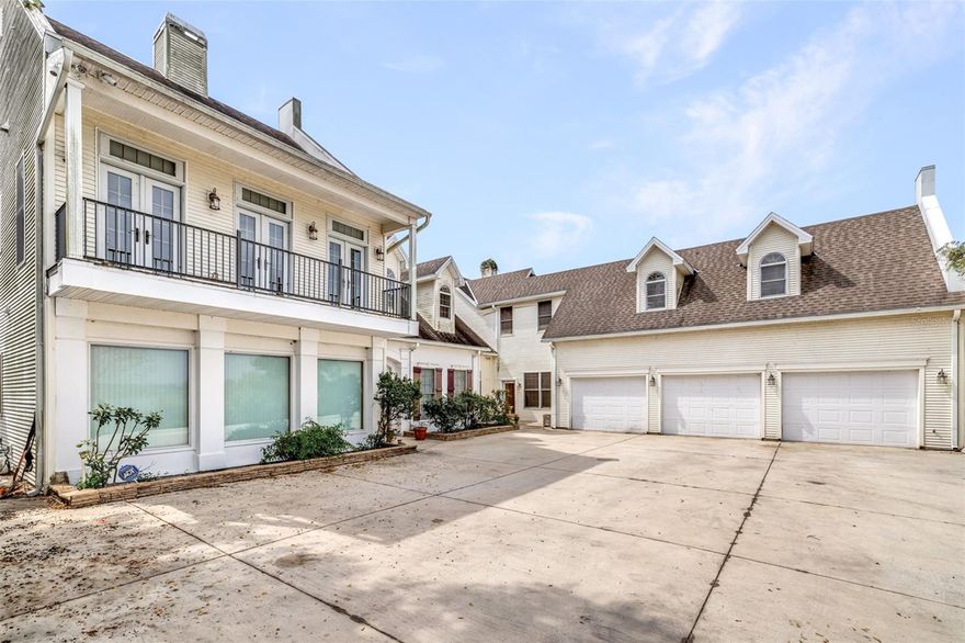 PRICE IMPROVEMENT! *** MOTIVATED SELLER! *** Discover unparalleled elegance with breathtaking views overlooking Lake Wailes! With an impressive layout featuring 4 bedrooms, 4 full baths, and 2 half baths across 4,654 sq. ft. of living space, luxury meets durability in this eco-friendly masterpiece. This magnificent hilltop home is made from the highest quality construction with soundproofing in every room and between the floors, expertly engineered to endure hurricanes, tornadoes, and earthquakes, ensuring peace of mind in any weather. Downstairs features a formal living and dining room, family room, and flex room, including three fireplaces. Step into the gourmet kitchen and let your culinary creativity flourish! Adorned with 42-inch cherry cabinets designed with rope inlay and spice racks, granite countertops, stone backsplash, a marble-top baker's prep station, a center island with seating, a second sink with food disposal, a built-in wine cooler, space for a hanging pot rack, and more, you will find this kitchen functional and practical. There is also a separate eating area off the kitchen and a walk-in pantry located next to the deluxe laundry room, which includes hookups for a utility sink. Retreat to the spacious downstairs master suite, featuring an inviting dressing/sitting room and a lavish walk-in closet. The master bath is a sanctuary of relaxation, boasting dual mirrored vanities, gorgeous granite countertops, chic cherry cabinets, a soothing whirlpool bath, and a separate marble shower. As you ascend the grand foyer with its stunning winding staircase, you’ll find two large bedrooms, one that opens to a private balcony with lake views. The Jack and Jill bath is perfect for family living, offering granite countertops, dual sinks, and a whirlpool tub, all wired for your entertainment needs. Upstairs also features a spacious second master suite, an executive office, and a huge movie room with a state-of-the-art sound system and upscale seating. You will also find a private fenced backyard and a large 3-car garage. The exterior requires a little care to make it yours...pressure washing and fresh landscaping. With too many exceptional features to list, this luxury home is more than just a residence—it's a lifestyle waiting for you to embrace! Schedule your viewing today!