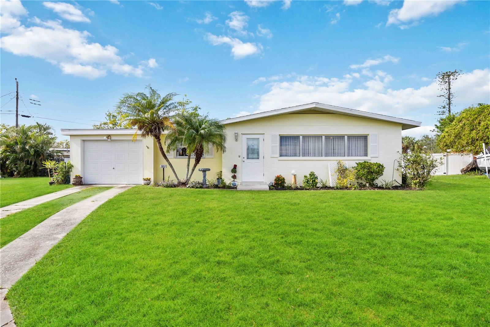 This charming 3-bedroom, 1-bath home with an attached 1-car garage is located in the heart of West Bradenton, in the peaceful Garden Heights neighborhood at the end of a secluded cul-de-sac. Offering no HOA, no CDD, or rental restrictions this block home offers an open floor plan, perfect for family gatherings and entertaining. Situated on an oversized .21 acre pie shaped lot, there's ample space for outdoor activities, including the potential to add a pool. The backyard also features a large storage shed, and an outdoor shower behind the garage adds a convenient touch. With the option to easily convert the garage into a fourth bedroom or a mother-in-law suite making the house a total of 1420 sq ft, this home offers great versatility. A must-see property you’re sure to fall in love with!